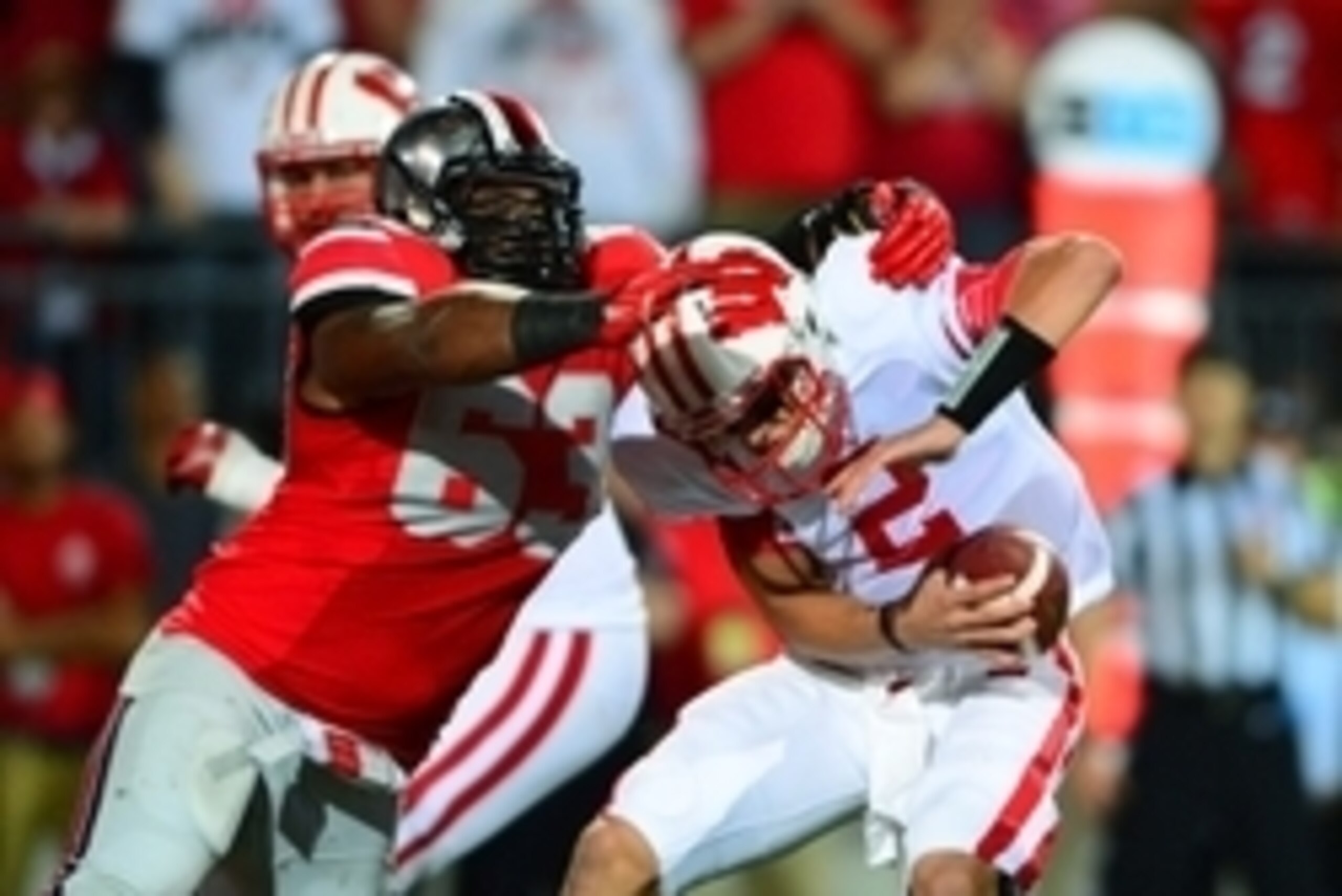 Sep 28, 2013; Columbus, OH, USA;  Wisconsin Badgers quarterback Joel Stave (2) is sacked by Ohio State Buckeyes defensive lineman Michael Bennett (63) during the third quarter at Ohio Stadium. Mandatory Credit: Andrew Weber-USA TODAY Sports