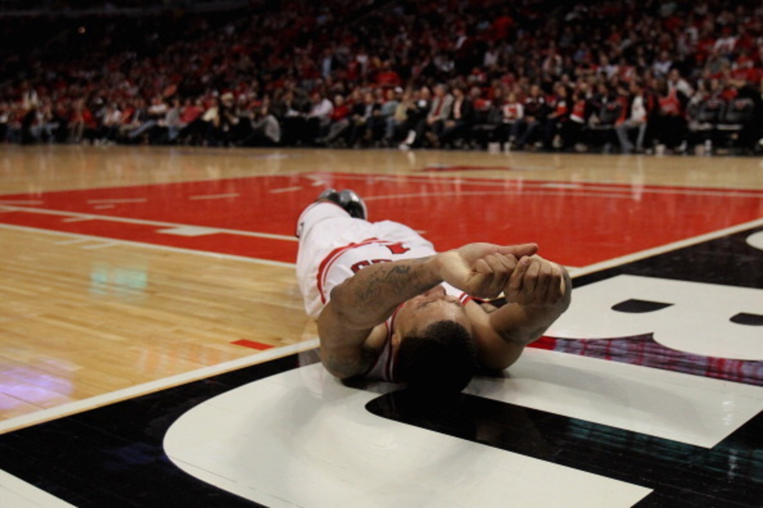 CHICAGO, IL - APRIL 28:  Derrick Rose #1 of the Chicago Bulls lays on the floor aftrer suffering an injury against the Philadelphia 76ers in Game One of the Eastern Conference Quarterfinals during the 2012 NBA Playoffs at the United Center on April 28, 20
