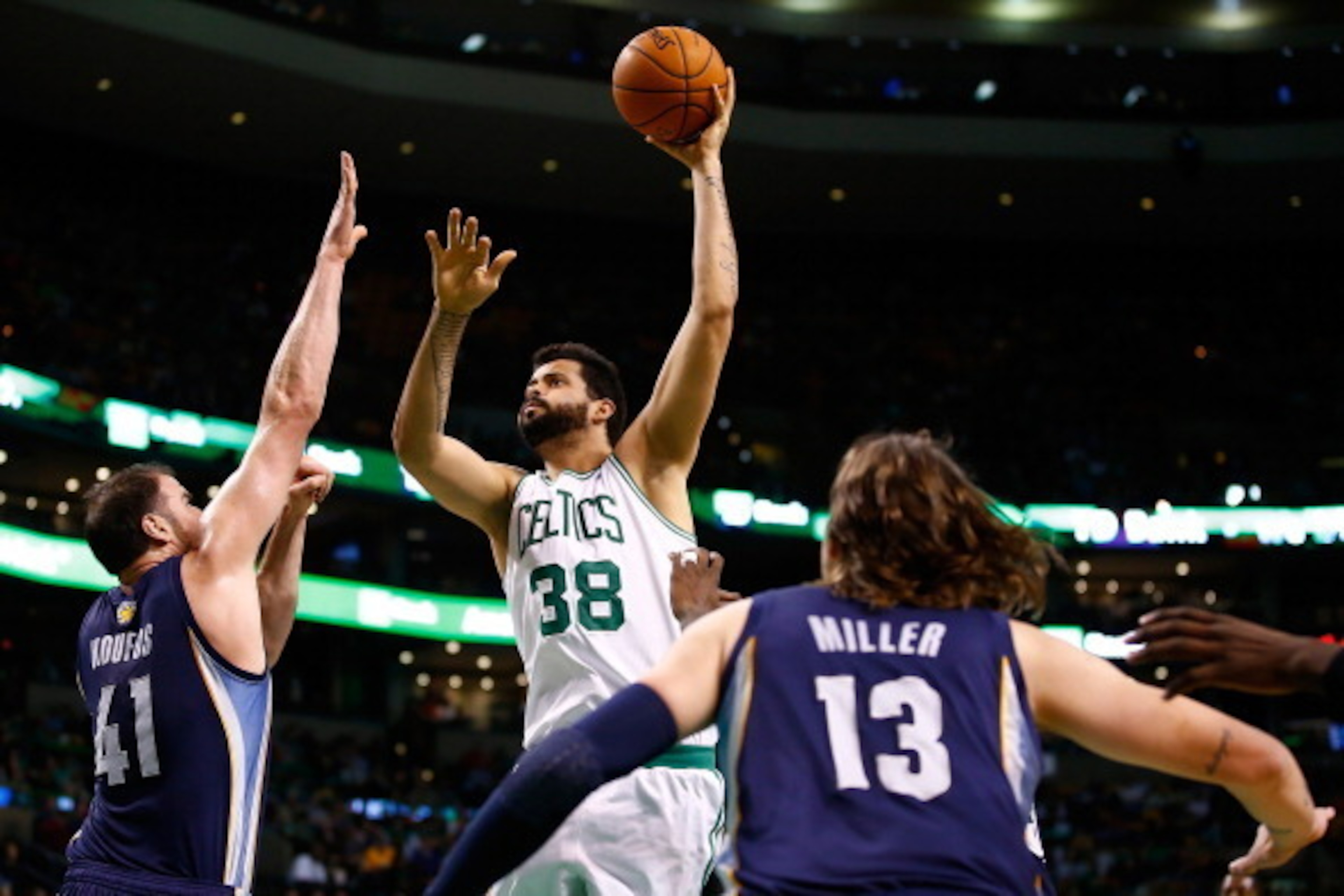 BOSTON, MA - NOVEMBER 27: Vitor Faverani #38 of the Boston Celtics shoots over Kosta Koufos #41 of the Memphis Grizzlies in the first quarter during the game at TD Garden on November 27, 2013 in Boston, Massachusetts.  NOTE TO USER: User expressly acknowl
