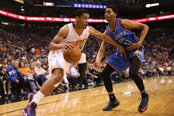 PHOENIX, AZ - APRIL 06:  Gerald Green #14 of the Phoenix Suns drives the ball past Jeremy Lamb #11 of the Oklahoma City Thunder during the NBA game at US Airways Center on April 6, 2014 in Phoenix, Arizona. The Suns defeated the Thunder 122-115.  NOTE TO 