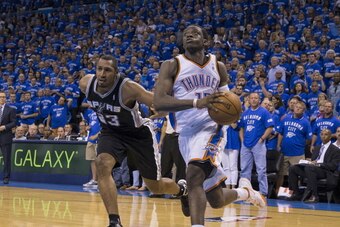 OKLAHOMA CITY, OK - MAY 25:  Reggie Jackson #15 of the Oklahoma City Thunder drives to the basket against the San Antonio Spurs in Game 3 of the Western Conference Finals during the 2014 NBA Playoffs at the Chesapeake Arena on May 25, 2014 in Oklahoma Cit