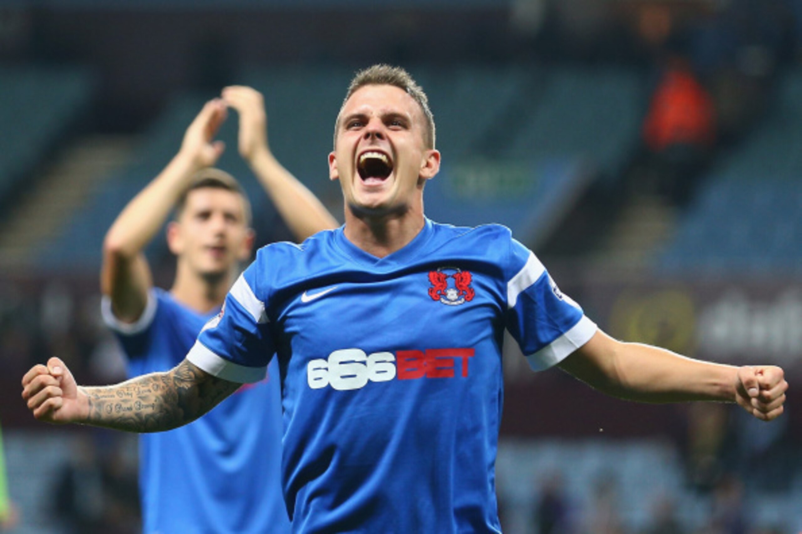 BIRMINGHAM, ENGLAND - AUGUST 27:  Dean Cox of Leyton Orient celebrates after the final whistle after his side won the Capital One Cup second round match between Aston Villa and Leyton Orient at Villa Park on August 27, 2014 in Birmingham, England.  (Photo