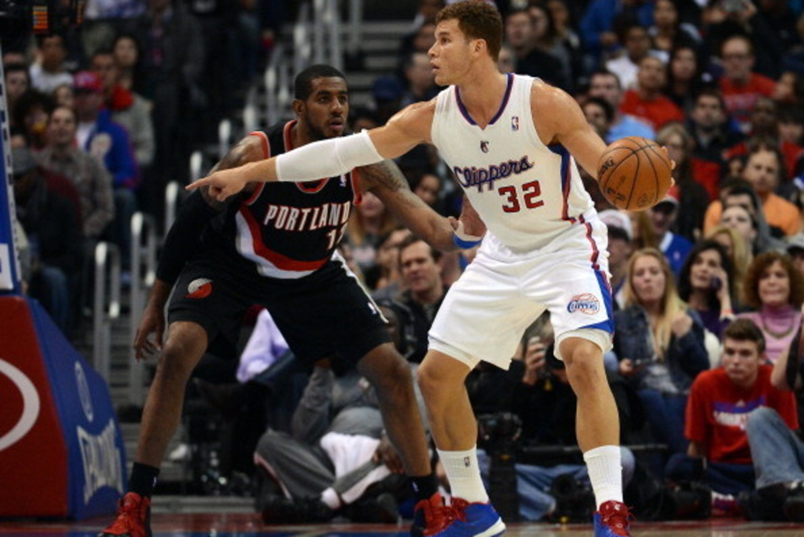LOS ANGELES, CA - JANUARY 27:  Blake Griffin #32 of the Los Angeles Clippers calls a play in front of LaMarcus Aldridge #12 of the Portland Trail Blazers at Staples Center on January 27, 2013 in Los Angeles, California.  NOTE TO USER: User expressly ackno