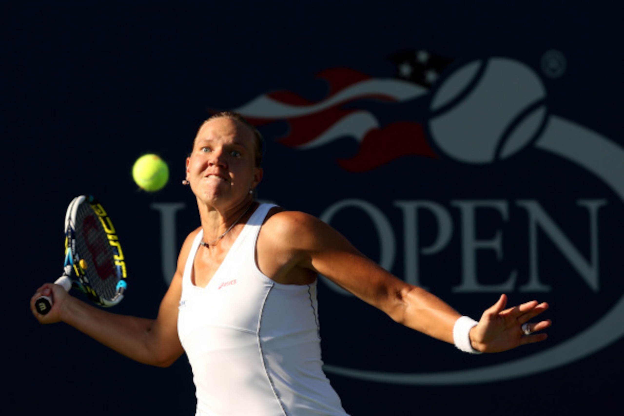NEW YORK, NY - AUGUST 28:   Kaia Kanepi of Estonia returns a shot against Samantha Stosur of Australia on Day Four of the 2014 US Open at the USTA Billie Jean King National Tennis Center on August 28, 2014 in the Flushing neighborhood of the Queens boroug
