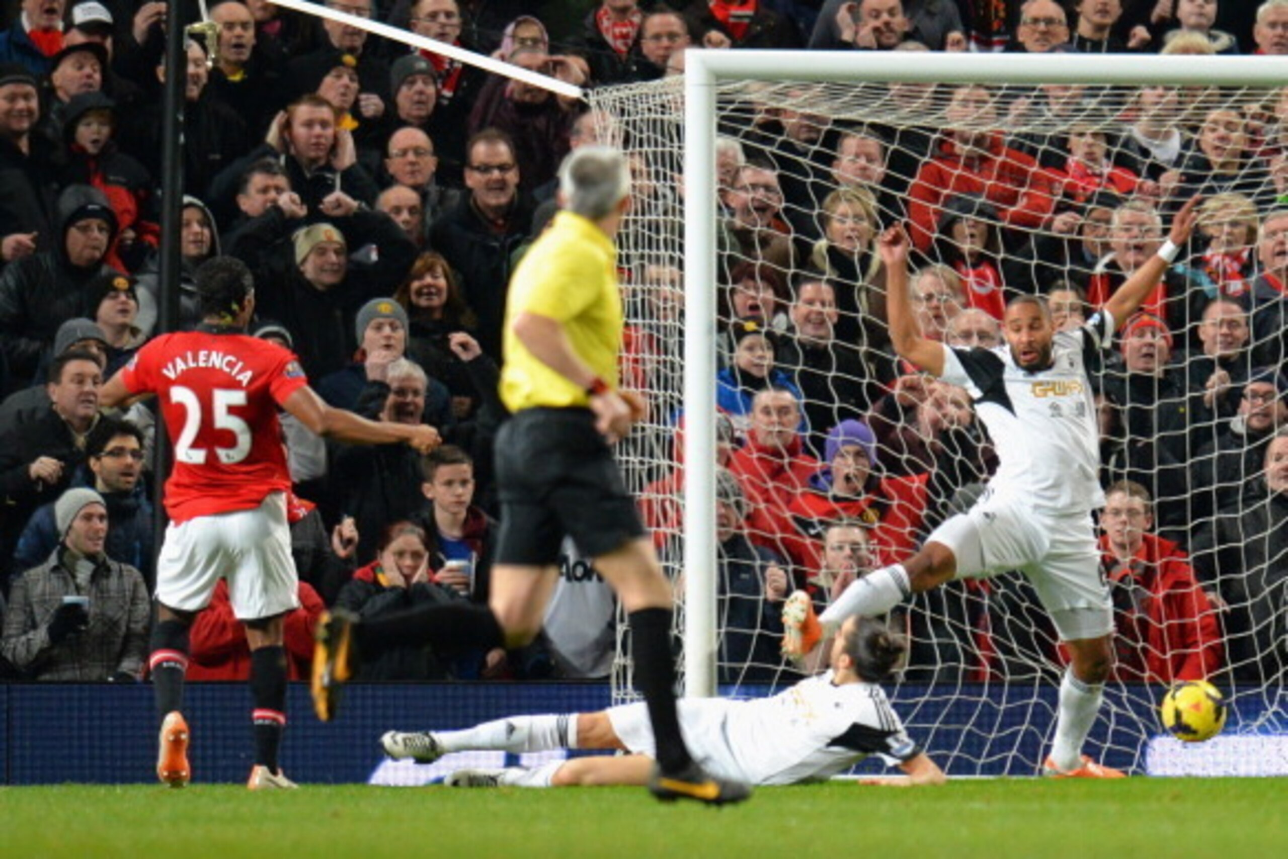 MANCHESTER, ENGLAND - JANUARY 11:  Luis Antonio Valencia of Manchester United scores the opening goal during the Barclays Premier League match between Manchester United and Swansea City at Old Trafford on January 11, 2014 in Manchester, England.  (Photo b