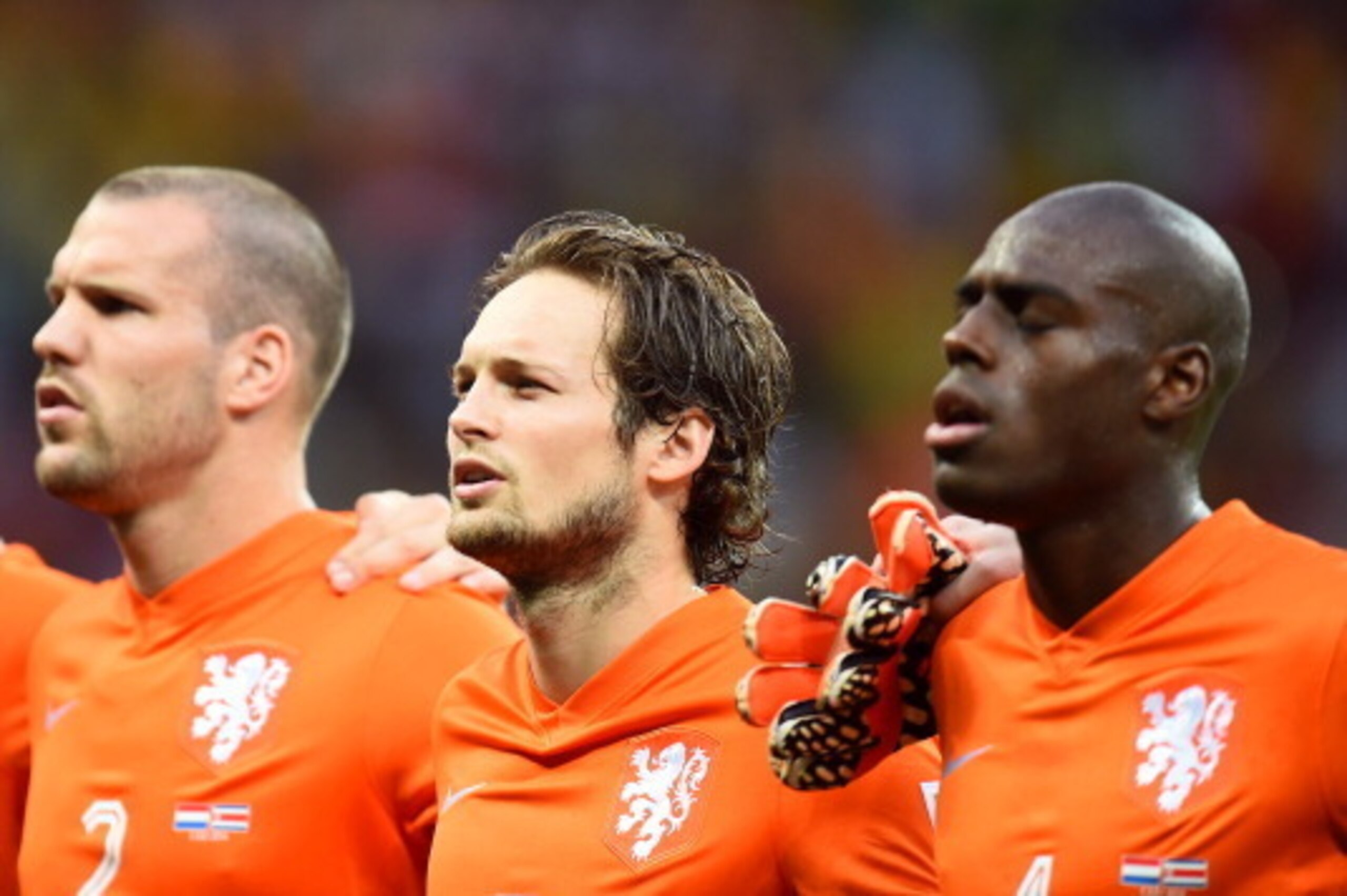 SALVADOR, BRAZIL - JULY 05:  (L-R) Ron Vlaar, Daley Blind and Bruno Martins Indi of the Netherlands sing the National Anthem prior to the 2014 FIFA World Cup Brazil Quarter Final match between the Netherlands and Costa Rica at Arena Fonte Nova on July 5, 