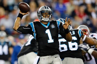 FOXBORO, MA - AUGUST 22:  Cam Newton #1 of the Carolina Panthers throws against the New England Patriots a preseason game at Gillette Stadium on August 22, 2014 in Foxboro, Massachusetts. (Photo by Jim Rogash/Getty Images)