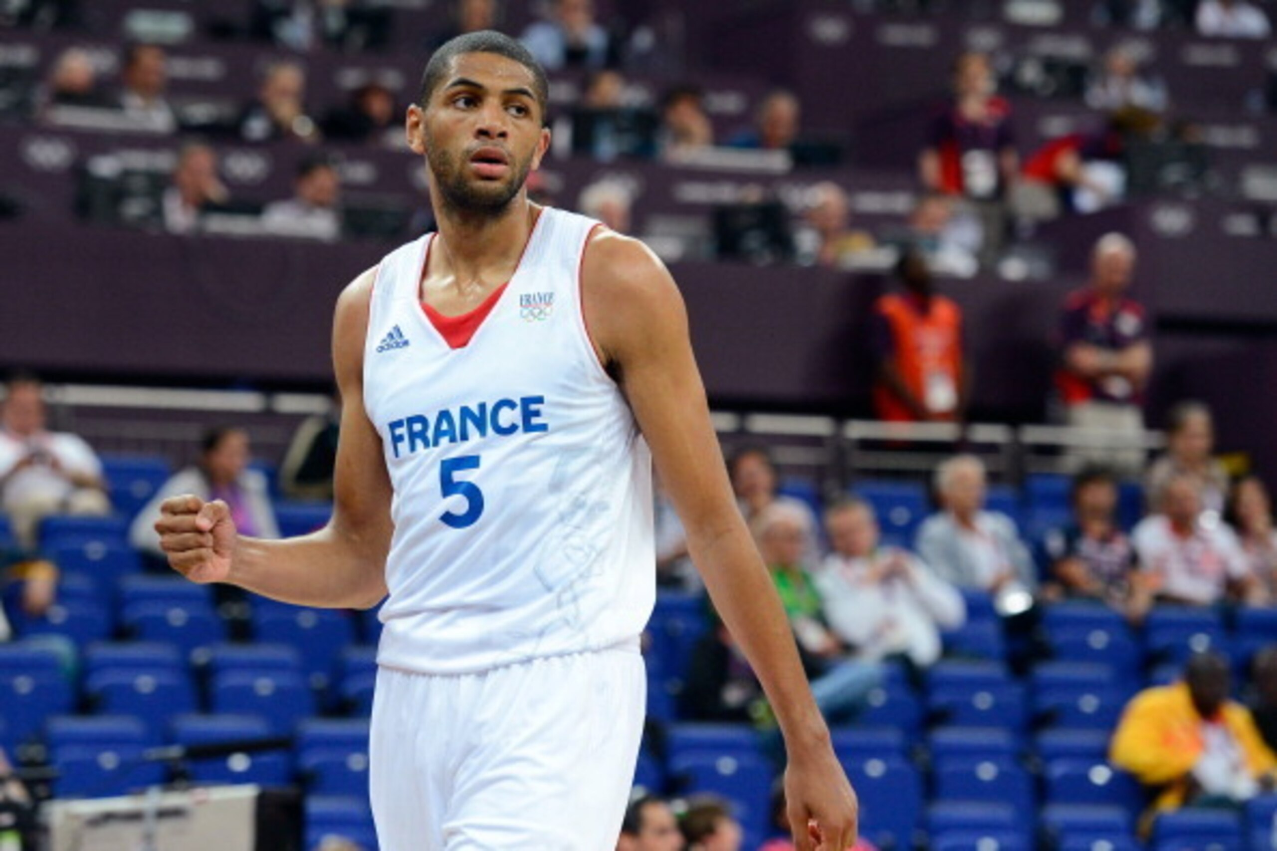 LONDON, ENGLAND - AUGUST 08: Nicolas Batum #5 of France reacts in the first half while taking on Spain during the Men's Basketball quaterfinal game on Day 12 of the London 2012 Olympic Games at North Greenwich Arena on August 8, 2012 in London, England. LONDON, ENGLAND - AUGUST 08: Nicolas Batum #5 of France reacts in the first half while taking on Spain during the Men's Basketball quaterfinal game on Day 12 of the London 2012 Olympic Games at North Greenwich Arena on August 8, 2012 in London, England.