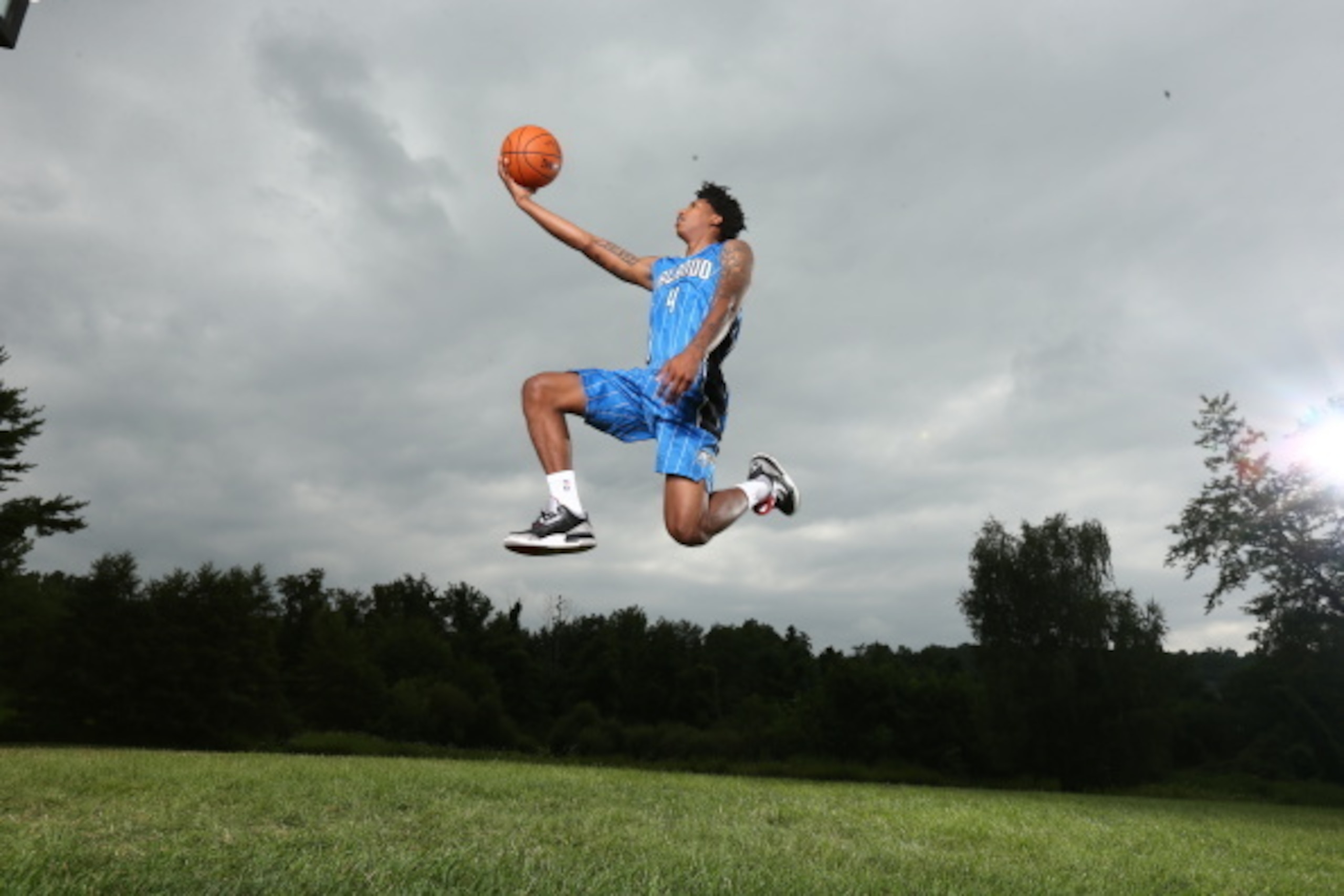 TARRYTOWN, NY - AUGUST 3: Elfrid Payton #4 of the Orlando Magic poses for a portrait during the 2014 NBA rookie photo shoot on August 3, 2014 at the Madison Square Garden Training Facility in Tarrytown, New York. NOTE TO USER: User expressly acknowledges 