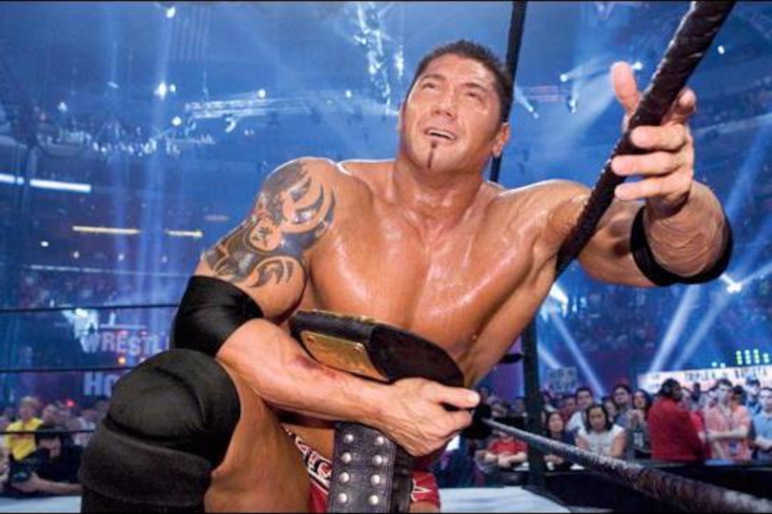 Batista celebrates after beating Triple H at WrestleMania 21.
