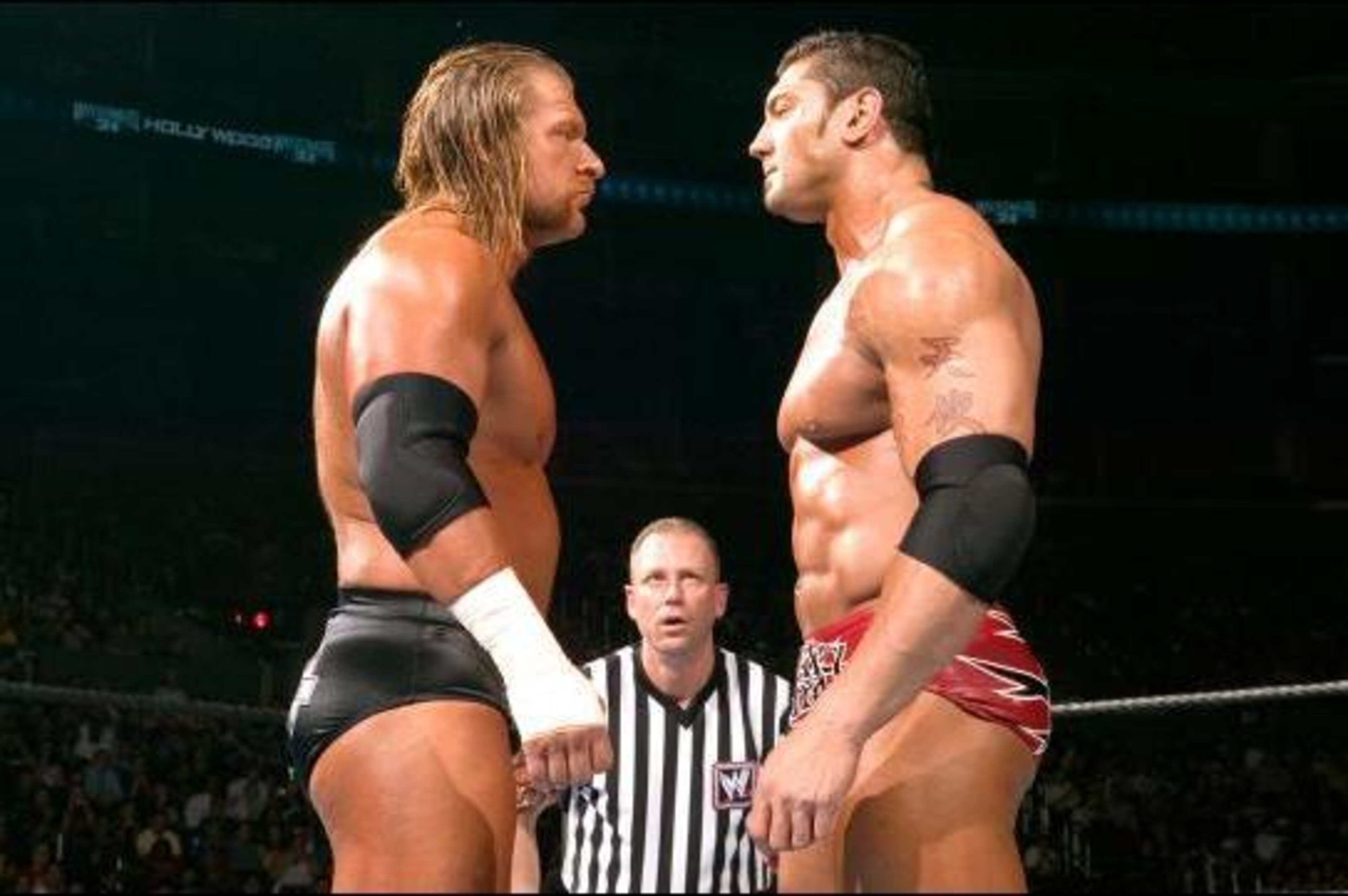 Triple H and Batista stare each other down at WrestleMania 21.
