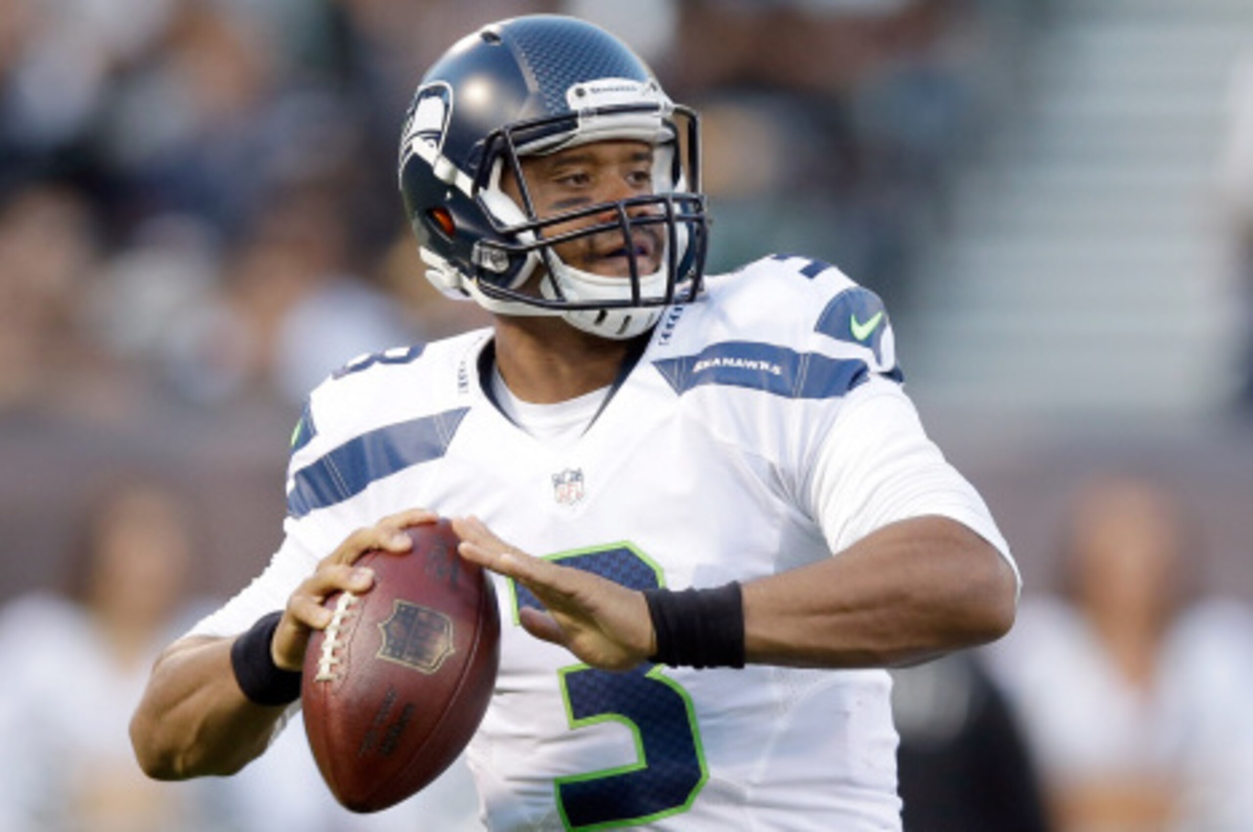 OAKLAND, CA - AUGUST 28:  Quarterback Russell Wilson #3 of the Seattle Seahawks in action against the Oakland Raiders at O.co Coliseum on August 28, 2014 in Oakland, California.  (Photo by Ezra Shaw/Getty Images)