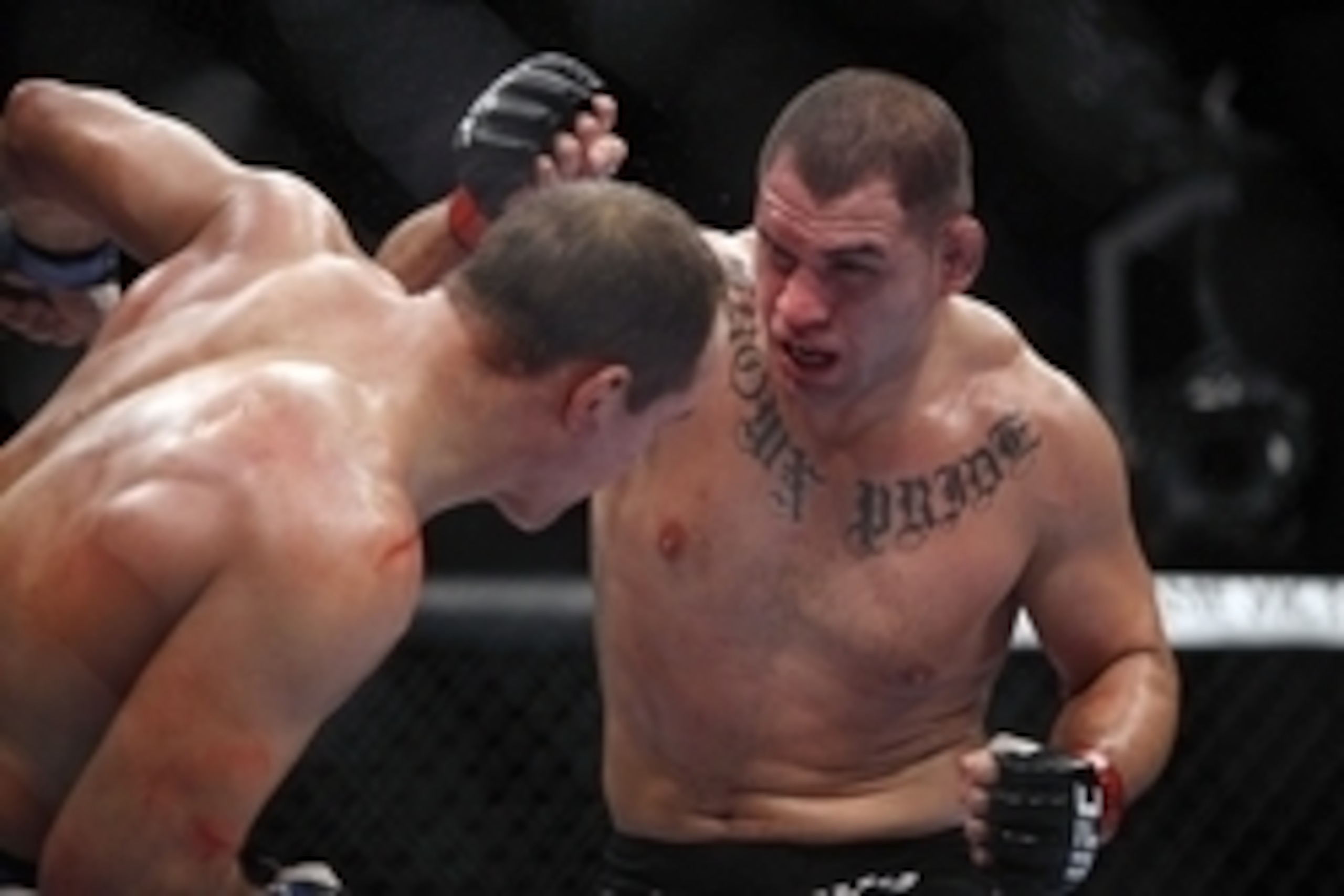 Oct 19, 2013; Houston, TX, USA; Cain Velasquez (red gloves) fights against Junior Dos Santos (blue gloves) in the world heavyweight championship bout during UFC 166 at Toyota Center. Mandatory Credit: Andrew Richardson-USA TODAY Sports