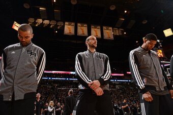SAN ANTONIO, TX - APRIL 20: Tony Parker #9, Manu Ginobili #20 and Tim Duncan #21 of the San Antonio Spurs on the court before Game One of the Western Conference Quarterfinals during the 2014 NBA Playoffs against the Dallas Mavericks on April 20, 2014 at t