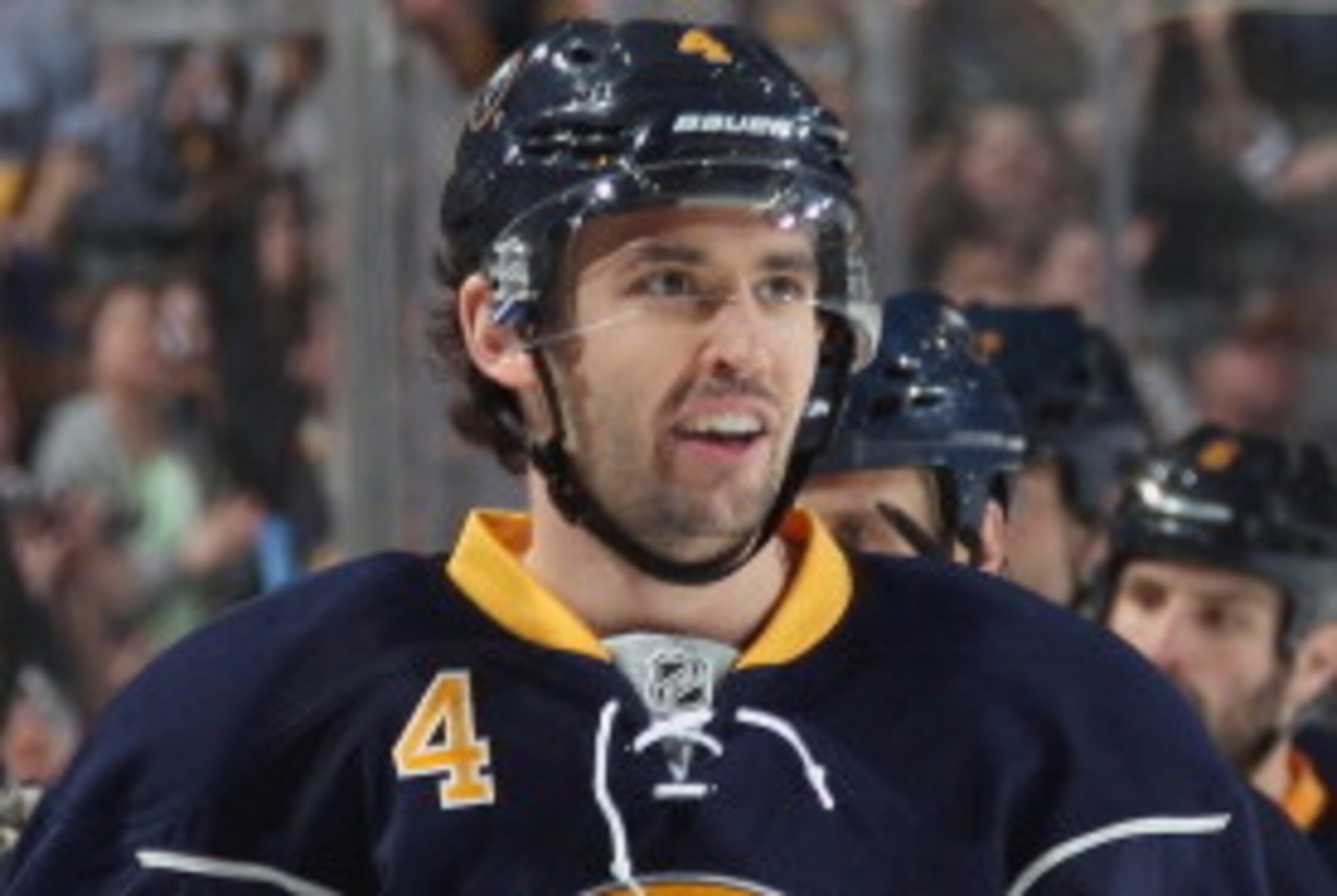 BUFFALO, NY - APRIL 13: Jamie McBain #4 of the Buffalo Sabres celebrates his first period goal against the New York Islanders at First Niagara Center on April 13, 2014 in Buffalo, New York.  (Photo by Jen Fuller/Getty Images)