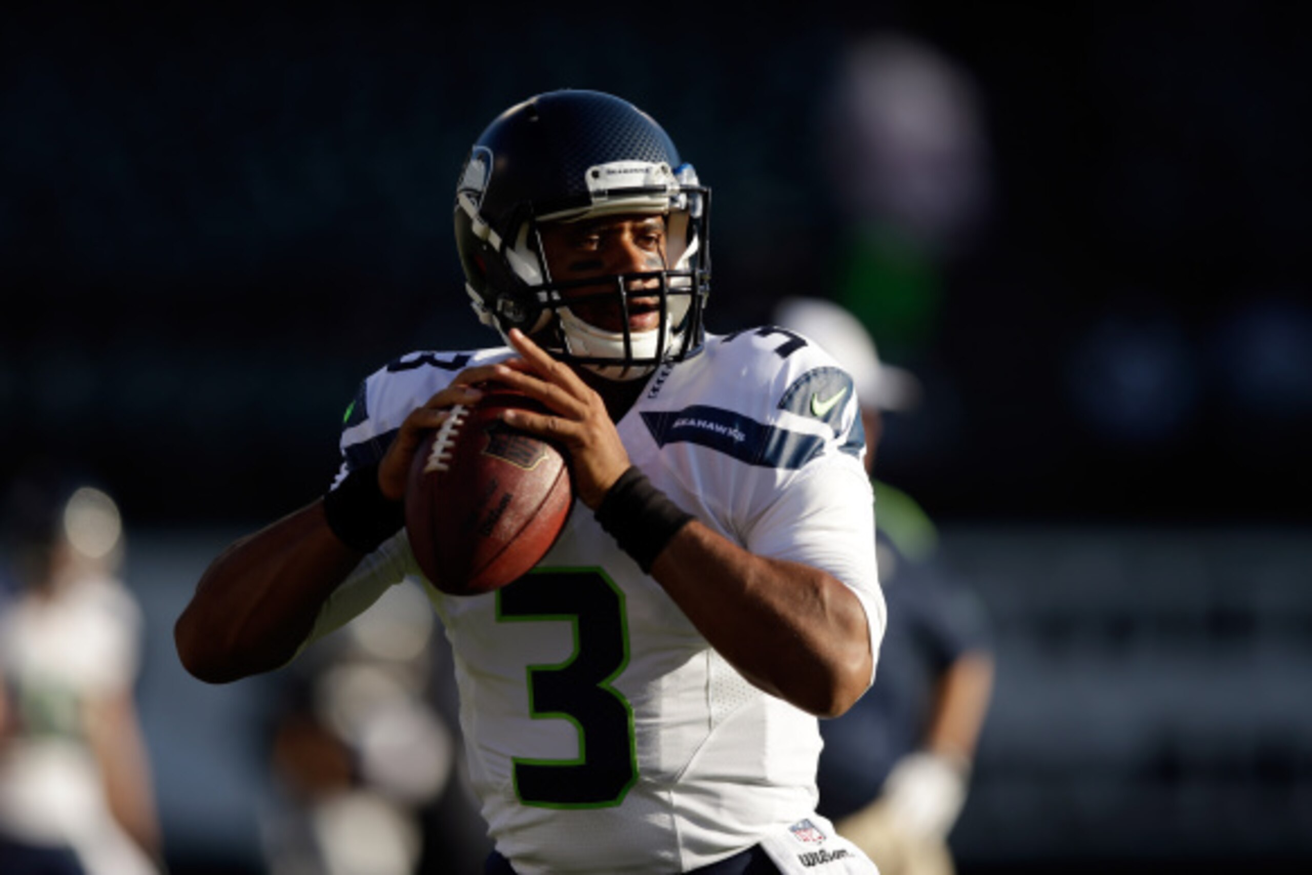 OAKLAND, CA - AUGUST 28:  Quarterback Russell Wilson #3 of the Seattle Seahawks warms up before their game against the Oakland Raiders at O.co Coliseum on August 28, 2014 in Oakland, California.  (Photo by Ezra Shaw/Getty Images)