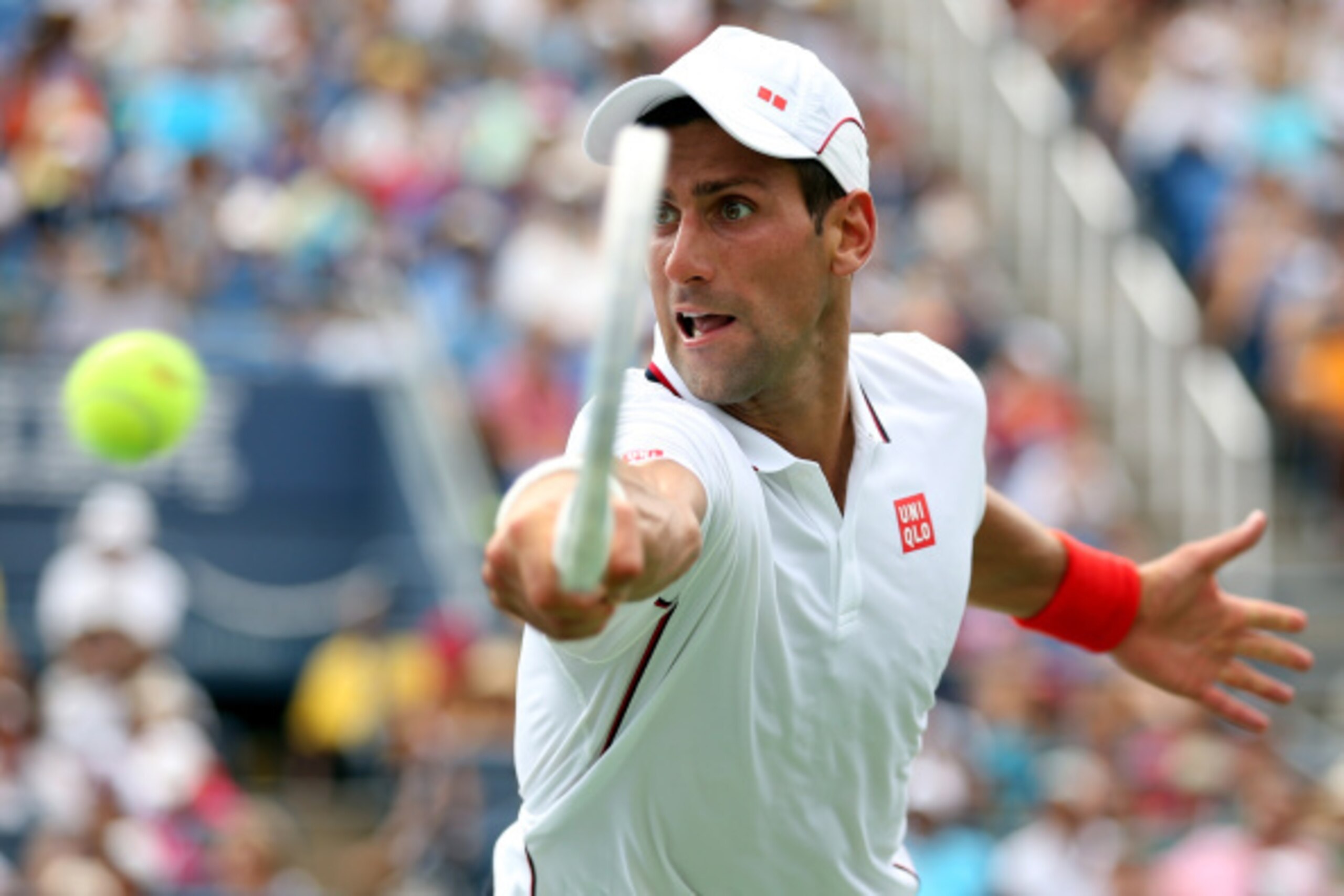 NEW YORK, NY - SEPTEMBER 01: Novak Djokovic of Serbia returns a shot to Philipp Kohlschreiber of Germany during their men's singles fourth round match on Day Eight of the 2014 US Open at the USTA Billie Jean King National Tennis Center on September 1, 20 NEW YORK, NY - SEPTEMBER 01: Novak Djokovic of Serbia returns a shot to Philipp Kohlschreiber of Germany during their men's singles fourth round match on Day Eight of the 2014 US Open at the USTA Billie Jean King National Tennis Center on September 1, 20
