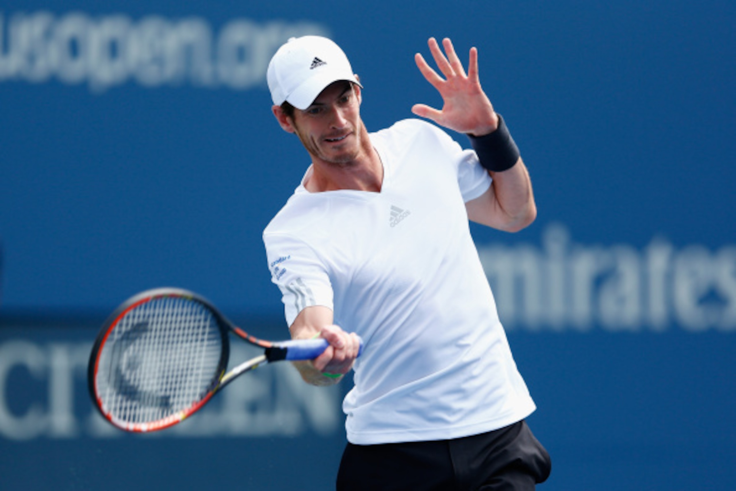 NEW YORK, NY - SEPTEMBER 01: Andy Murray of Great Britain returns a shot to Jo-Wilfried Tsonga of France during their men's singles fourth round match on Day Eight of the 2014 US Open at the USTA Billie Jean King National Tennis Center on September 1, 201 NEW YORK, NY - SEPTEMBER 01: Andy Murray of Great Britain returns a shot to Jo-Wilfried Tsonga of France during their men's singles fourth round match on Day Eight of the 2014 US Open at the USTA Billie Jean King National Tennis Center on September 1, 201