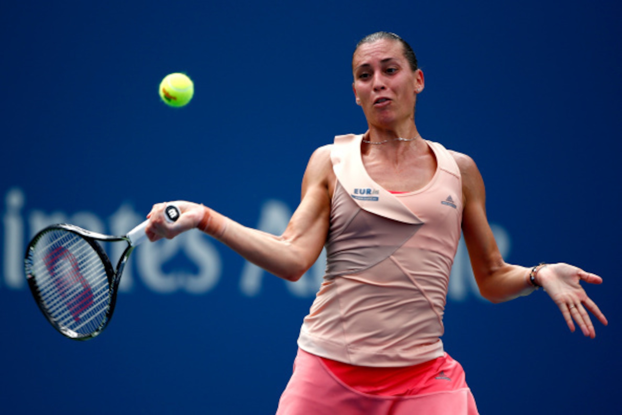 NEW YORK, NY - SEPTEMBER 01: Flavia Pennetta of Italy returns a shot against Casey Dellacqua of Australia during their women's singles fourth round match on Day Eight of the 2014 US Open at the USTA Billie Jean King National Tennis Center on September 1, NEW YORK, NY - SEPTEMBER 01: Flavia Pennetta of Italy returns a shot against Casey Dellacqua of Australia during their women's singles fourth round match on Day Eight of the 2014 US Open at the USTA Billie Jean King National Tennis Center on September 1,