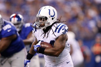 INDIANAPOLIS, IN - AUGUST 16: Trent Richardson #34 of the Indianapolis Colts runs with the ball in the first half of an NFL preseason game against the New York Giants at Lucas Oil Stadium on August 16, 2014 in Indianapolis, Indiana. (Photo by Joe Robbins/