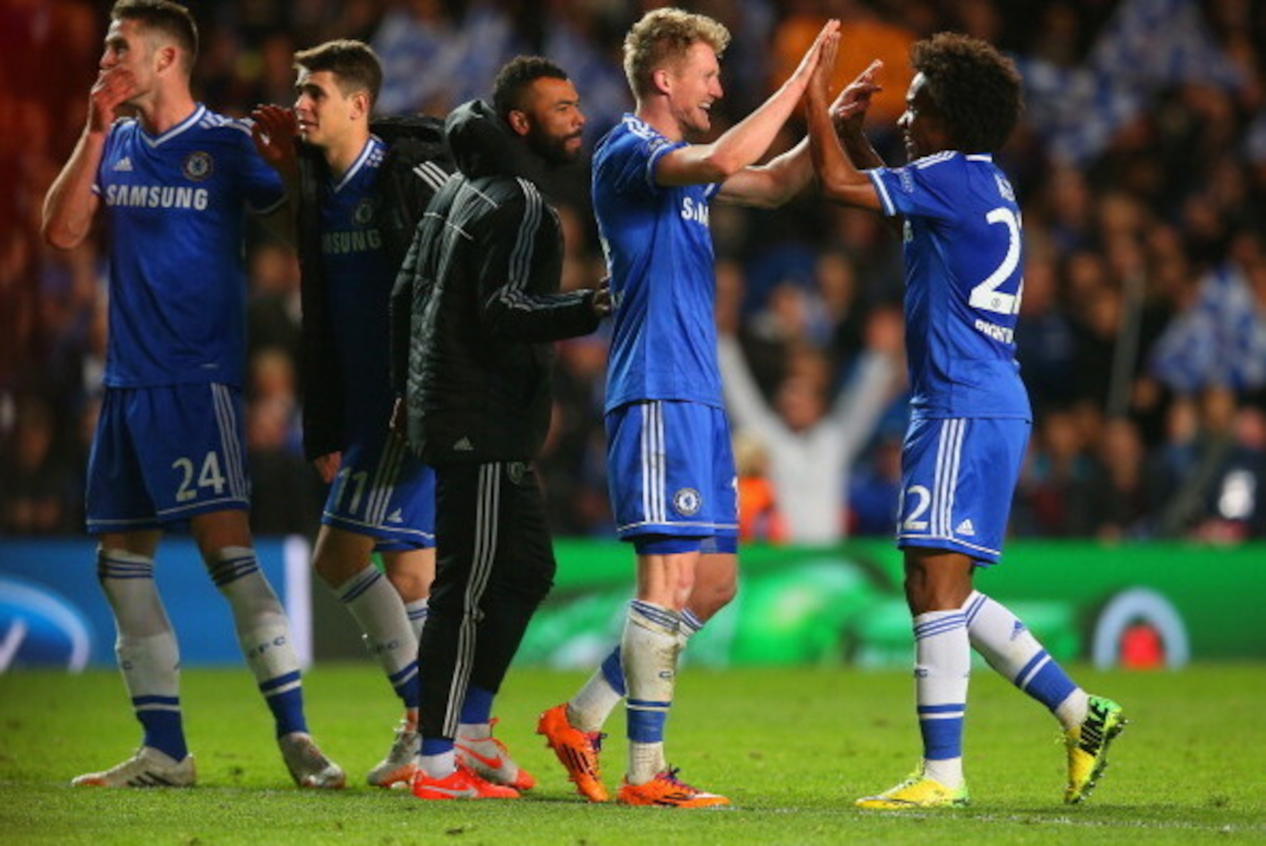 LONDON, ENGLAND - APRIL 08:  Andre Schurrle of Chelsea celebrates victory with Willian of Chelsea and Ashley Cole of Chelsea during the UEFA Champions League Quarter Final second leg match between Chelsea and Paris Saint-Germain FC at Stamford Bridge on A