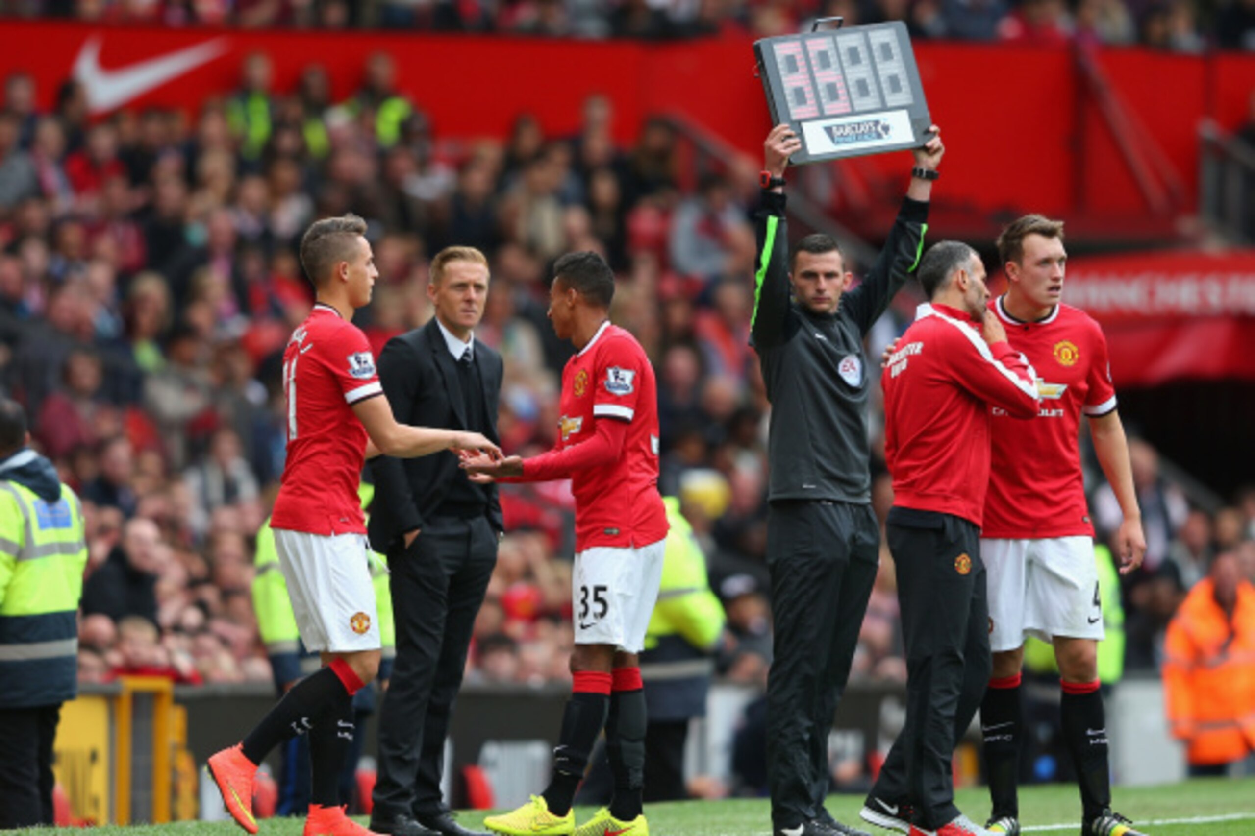 MANCHESTER, ENGLAND - AUGUST 16:  Jesse Lingard of Manchester United is replaced by Adnan Januzaj after sustaining an injury during the Barclays Premier League match between Manchester United and Swansea City at Old Trafford on August 16, 2014 in Manchest