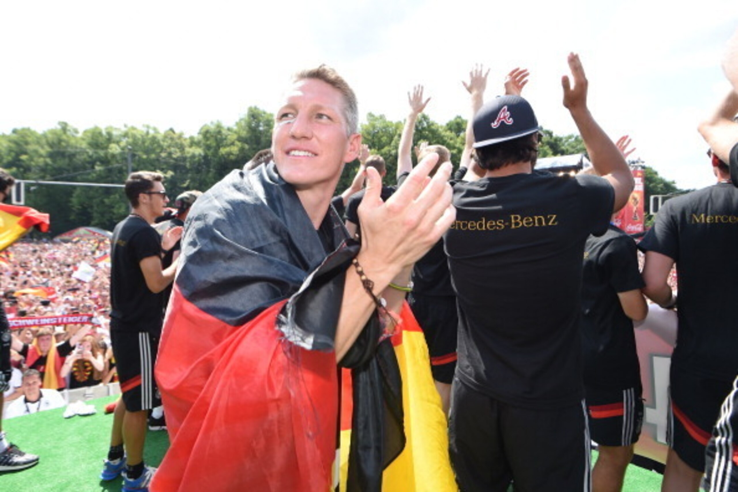 BERLIN, GERMANY - JULY 15: Bastian Schweinsteiger celebrates during the German team victory ceremony on July 15, 2014 in Berlin, Germany. Germany won the 2014 FIFA World Cup Brazil match against Argentina in Rio de Janeiro on July 13.  (Photo by Markus Gi