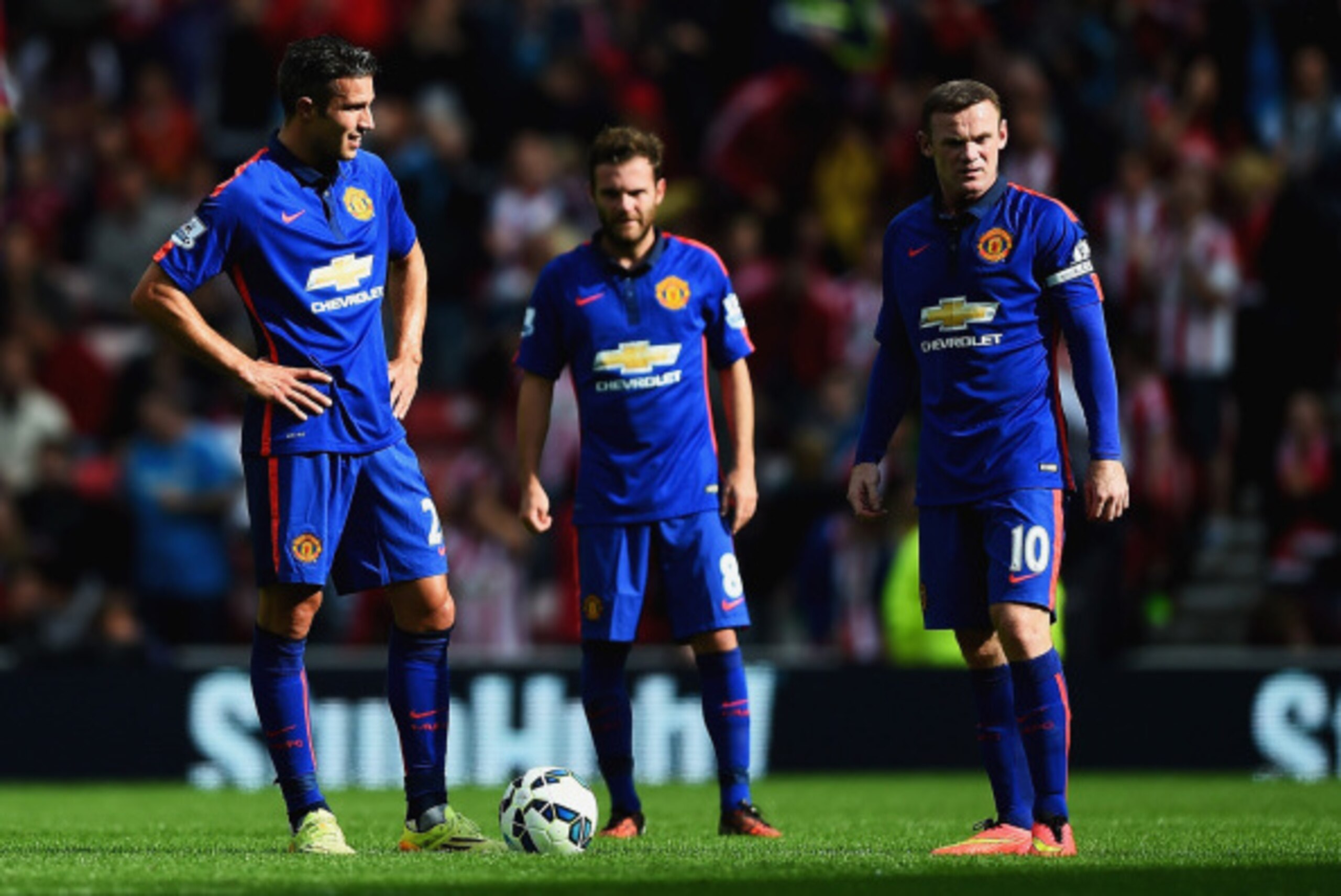 SUNDERLAND, ENGLAND - AUGUST 24:  Robin van Persie (L), Juan Mata and Wayne Rooney of Manchester United look dejected after the goal scored by Jack Rodwell of Sunderland during the Barclays Premier League match between Sunderland and Manchester United at 