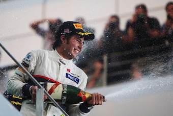KUALA LUMPUR, MALAYSIA - MARCH 25:  Sergio Perez of Mexico and Sauber F1 celebrates on the podium after finishing second during the Malaysian Formula One Grand Prix at the Sepang Circuit on March 25, 2012 in Kuala Lumpur, Malaysia.  (Photo by Ker Robertso