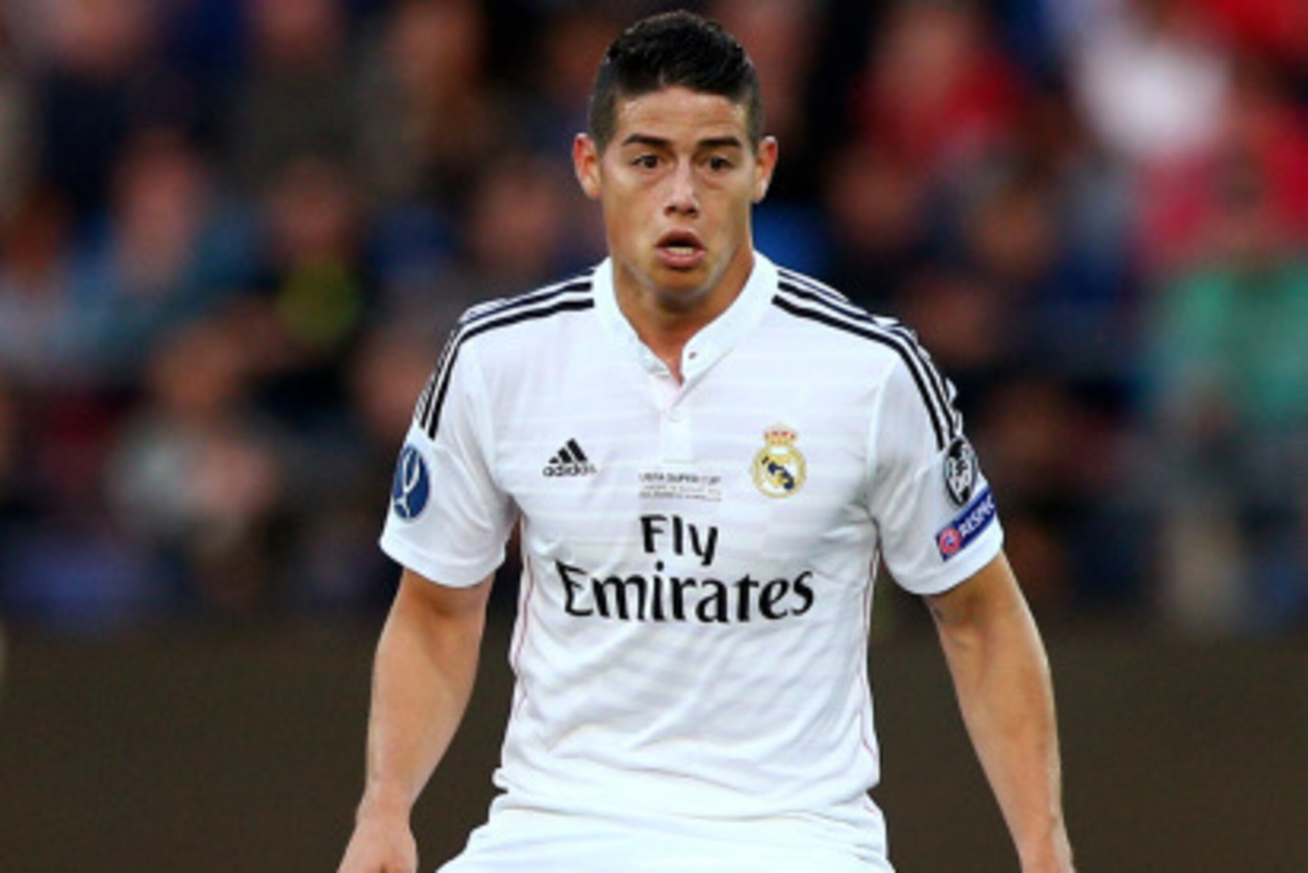 CARDIFF, WALES - AUGUST 12:  James Rodriguez of Real Madrid controls the ball during the UEFA Super Cup between Real Madrid and Sevilla FC at Cardiff City Stadium on August 12, 2014 in Cardiff, Wales.  (Photo by Clive Mason/Getty Images)