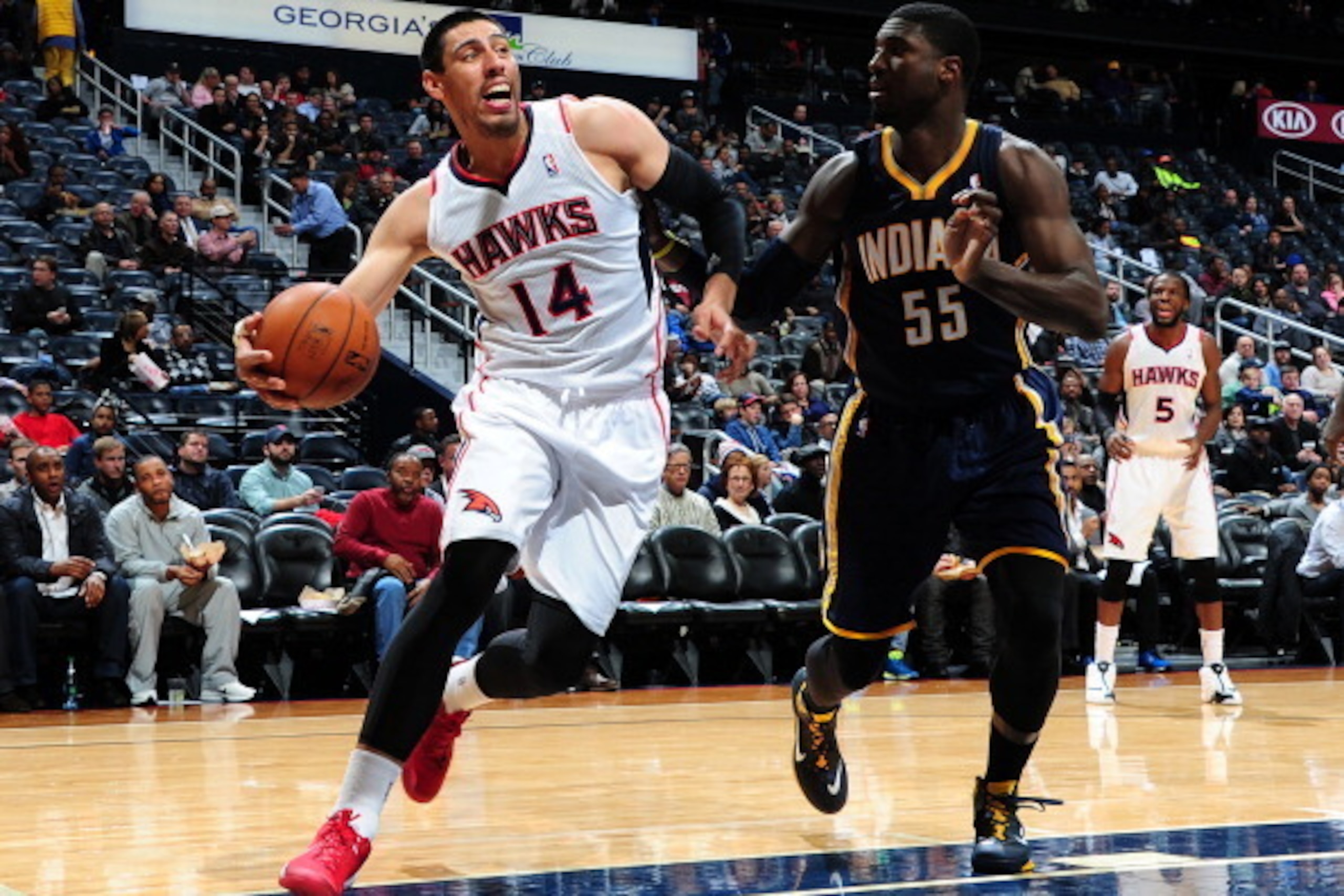ATLANTA, GA - FEBRUARY 4: Gustavo Ayon #14 of the Atlanta Hawks drives baseline against the Indiana Pacers on February 4, 2014 at Philips Arena in Atlanta, Georgia.  NOTE TO USER: User expressly acknowledges and agrees that, by downloading and/or using th