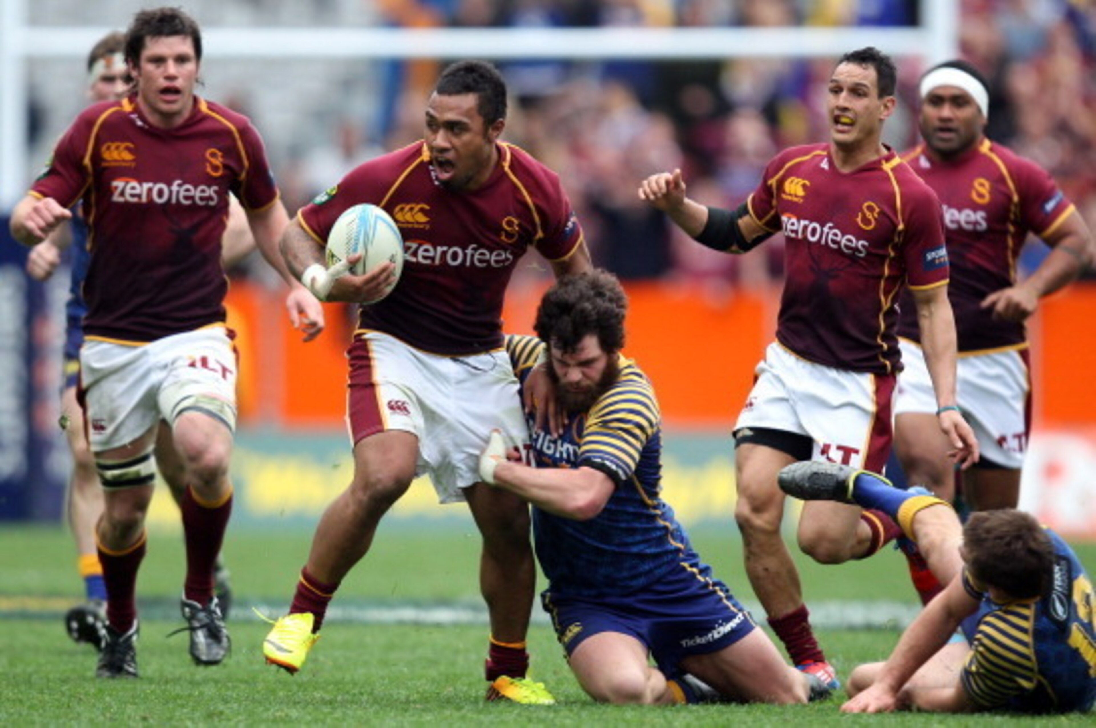 DUNEDIN, NEW ZEALAND - SEPTEMBER 28: Willis Halaholo of Southland attempts to bust the attempted tackle of Kieran Moffat of Otago during the round seven ITM Cup match between Otago and Southland at Forsyth Barr Stadium on September 28, 2013 in Dunedin, N DUNEDIN, NEW ZEALAND - SEPTEMBER 28: Willis Halaholo of Southland attempts to bust the attempted tackle of Kieran Moffat of Otago during the round seven ITM Cup match between Otago and Southland at Forsyth Barr Stadium on September 28, 2013 in Dunedin, N
