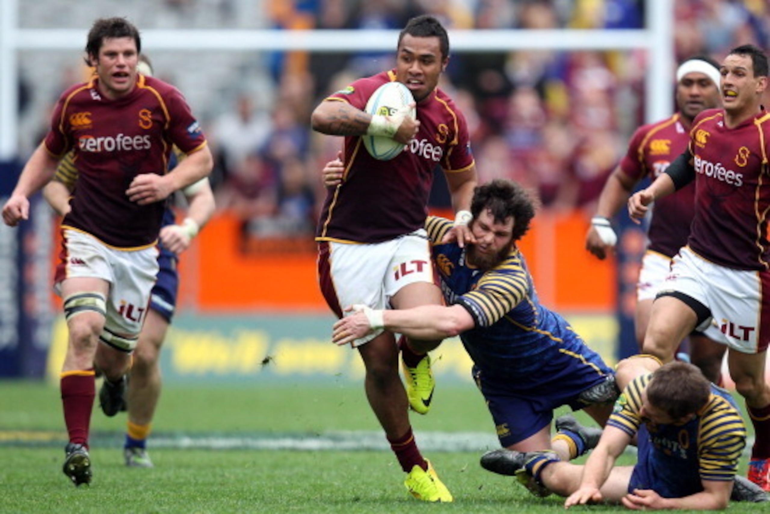 DUNEDIN, NEW ZEALAND - SEPTEMBER 28:  Willis Halaholo of Southland attempts to bust the attempted tackle of Kieran Moffat of Otago during the round seven ITM Cup match between Otago and Southland at Forsyth Barr Stadium on September 28, 2013 in Dunedin, N