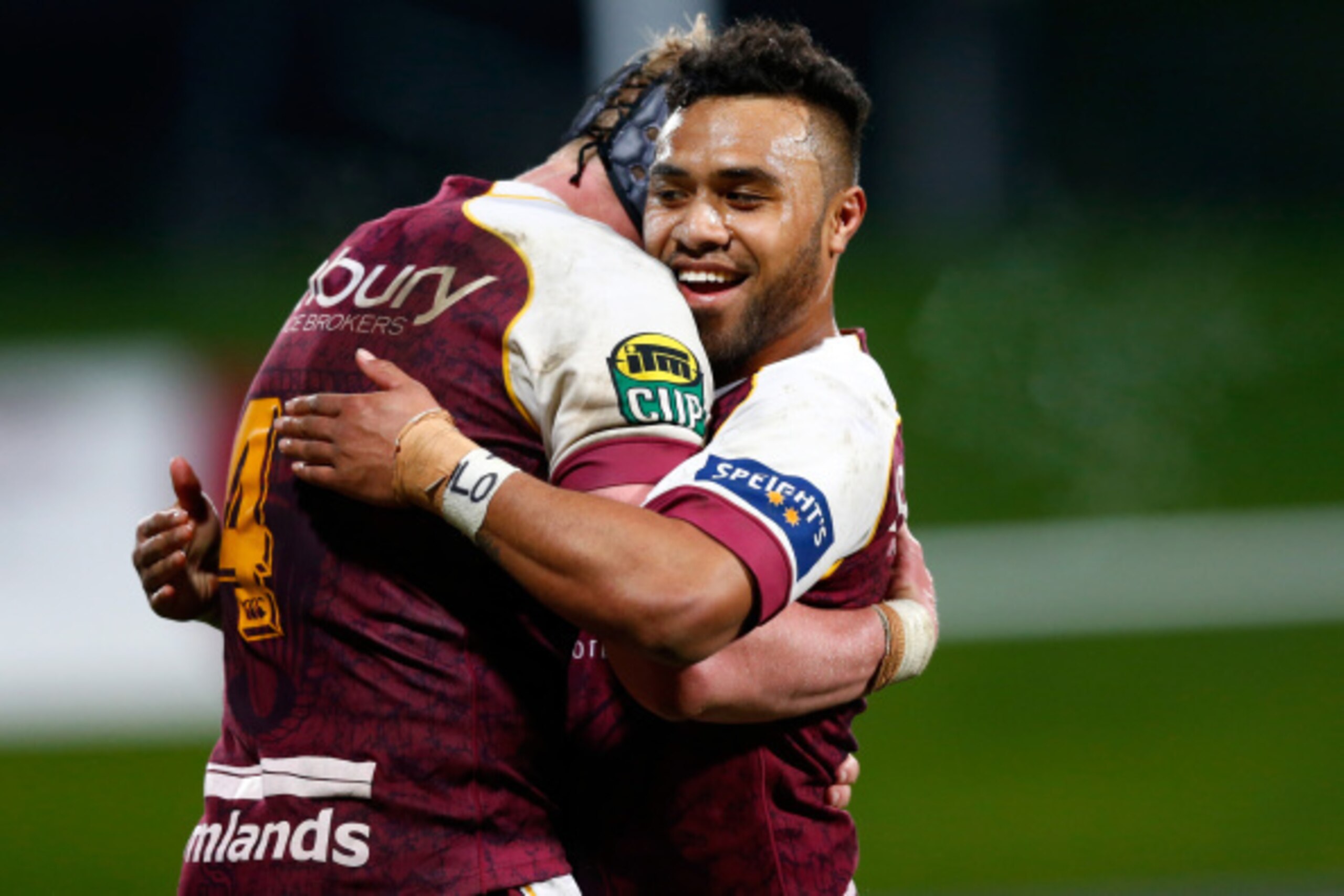 AUCKLAND, NEW ZEALAND - AUGUST 21: Willis Halaholo of Southland hugs Josh Bekhuis (L) on full time during the round two ITM Cup match between North Harbour and Southland at QBE Stadium on August 21, 2014 in Auckland, New Zealand.  (Photo by Phil Walter/Ge