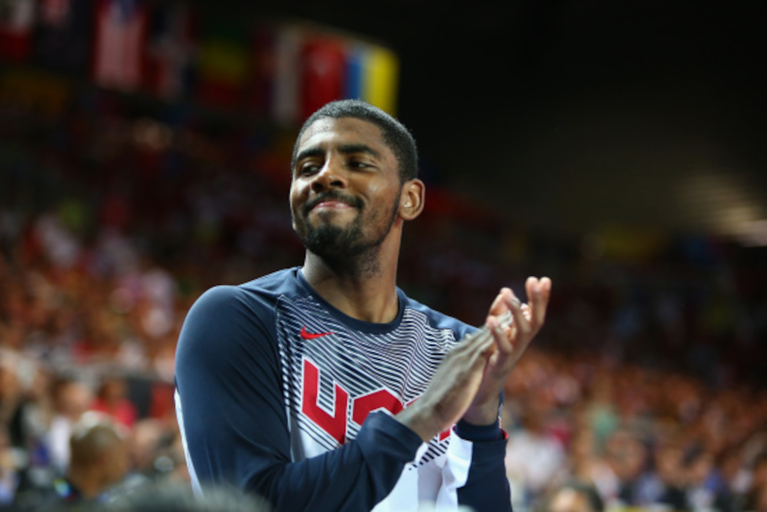 BILBAO, SPAIN - AUGUST 31: Kyrie Irving #10 of the USA Basketball Men's National Team cheers for his teammates during a game against the Turkey Basketball Men's National Team during the 2014 FIBA World Cup at Bizkaia Arena in Bilbao Exhibition Centre on A