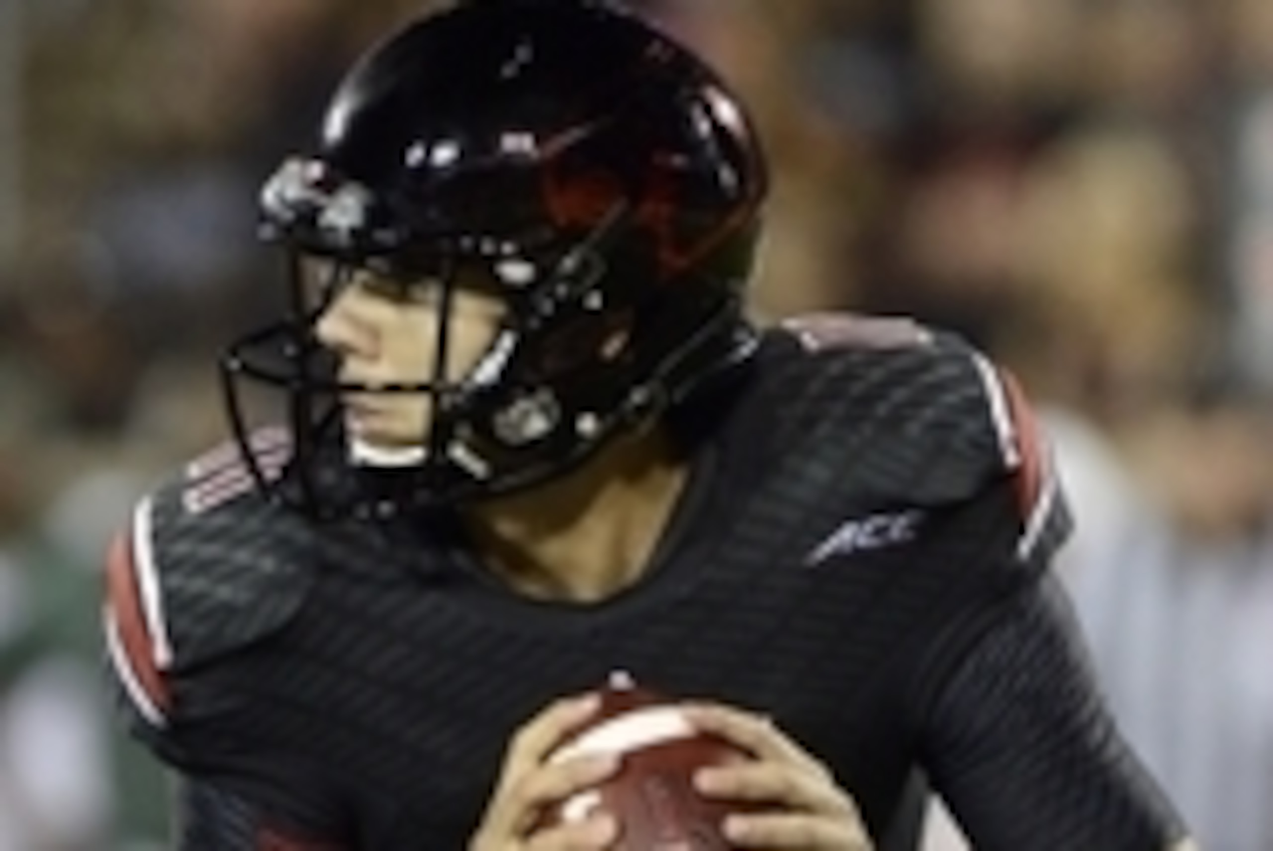 Sep 1, 2014; Louisville, KY, USA; Louisville Cardinals quarterback Will Gardner (11) drops back to pass the ball against the Miami Hurricanes during the second half of play at Papa John's Cardinal Stadium. Louisville defeated Miami 31-13.  Mandatory Credi