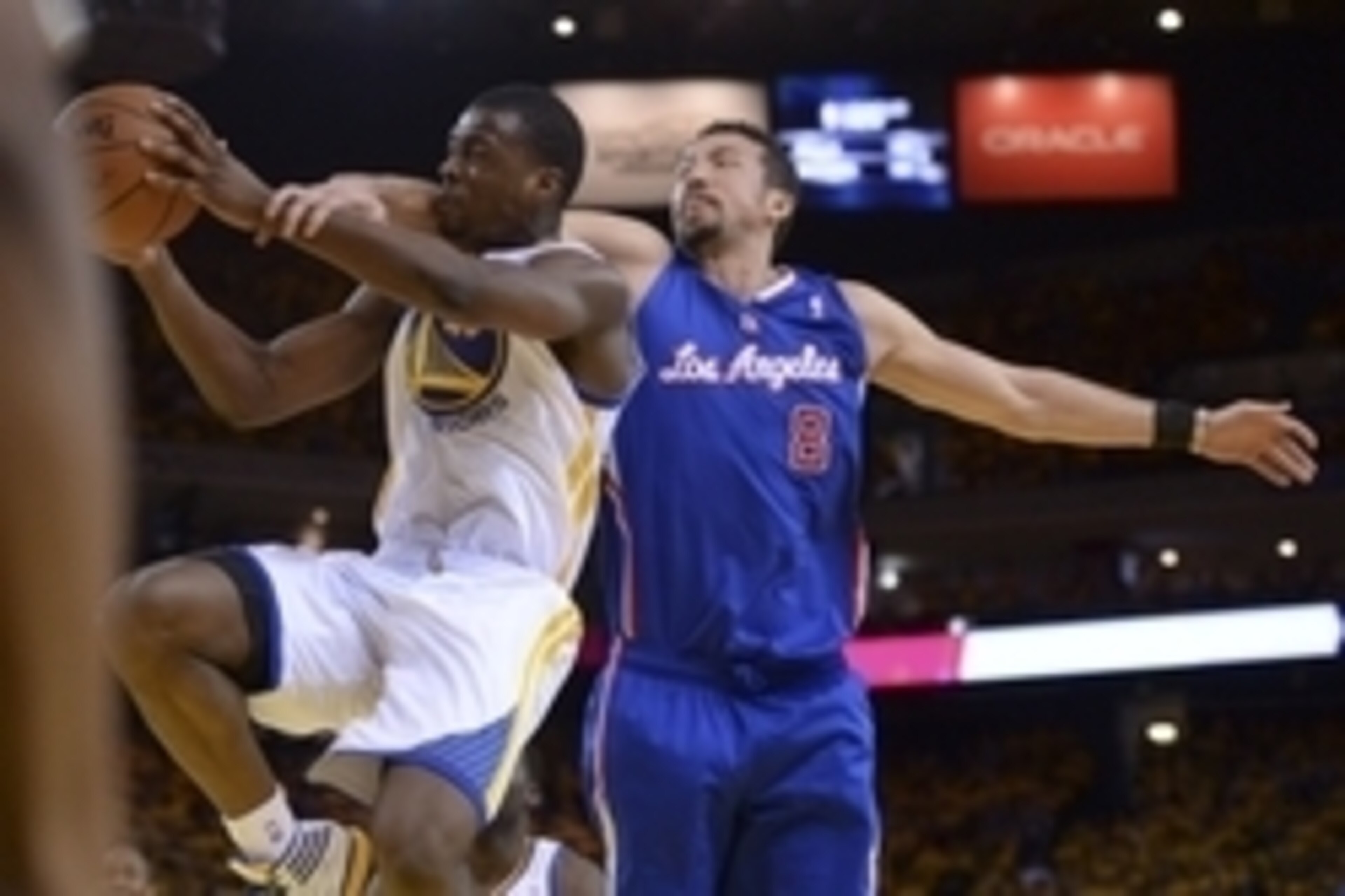 Apr 27, 2014; Oakland, CA, USA; Golden State Warriors forward Harrison Barnes (40) is fouled by Los Angeles Clippers forward Hedo Turkoglu (8) for a flagrant-1 call during the fourth quarter in game four of the first round of the 2014 NBA Playoffs at Orac