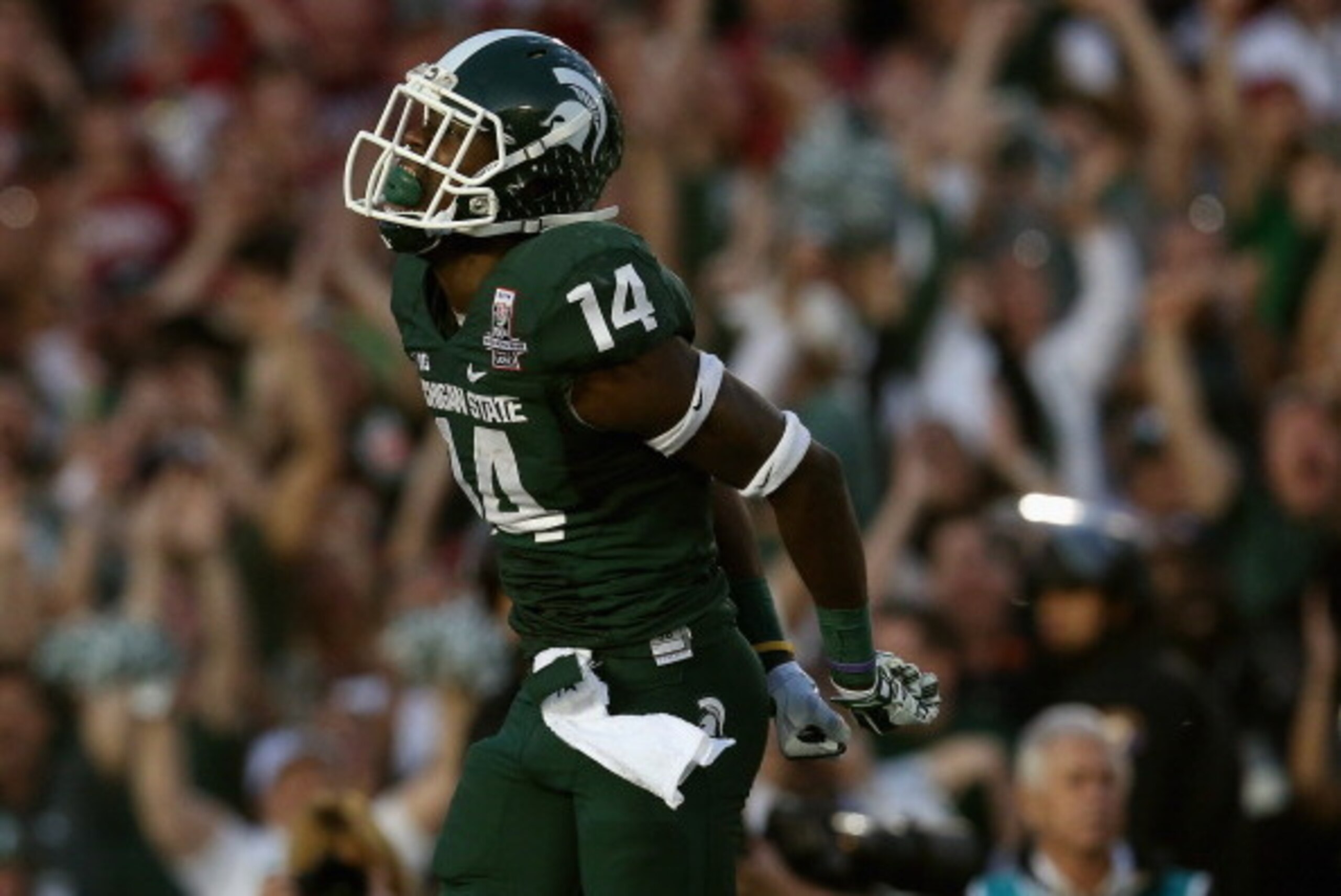 PASADENA, CA - JANUARY 01:  Wide receiver Tony Lippett #14 of the Michigan State Spartans celebrates a touchdown in the fourth quarter of the 100th Rose Bowl Game presented by Vizio against the Stanford Cardinal at the Rose Bowl on January 1, 2014 in Pasa