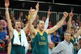 LONDON, ENGLAND - AUGUST 04:  (L-R) Joe Ingles #7, Aleks Maric #15, head coach Brett Brown and Matt Nielsen #14 of Australia react on the bench in the final moments of the Men's Basketball Preliminary Round match against Great Britain on Day 8 of the Lond
