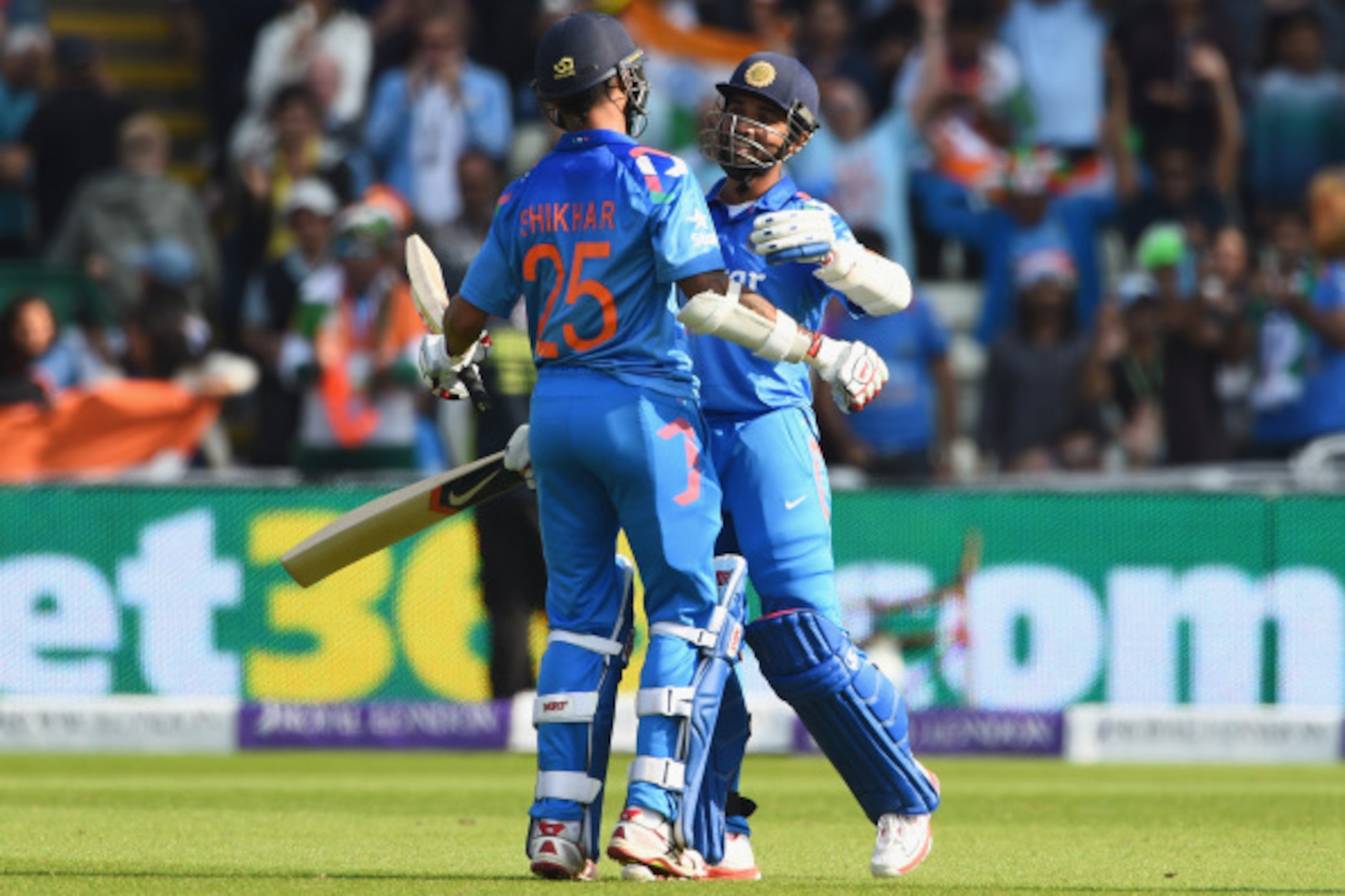BIRMINGHAM, ENGLAND - SEPTEMBER 02:  Ajinka Rahane of India celebrates his century with team-mate Shikhar Dhawan during the 4th Royal London One-Day International match between England and India at Edgbaston on September 2, 2014 in Birmingham, England.  (