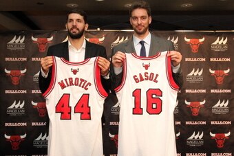 CHICAGO, IL - JULY 18: Chicago Bulls general manager Gar Forman and head coach Tom Thibodeau introduce newly-signed free agents Nikola Mirotic and Pau Gasol during a press conference at the United Center on July 18, 2014  in Chicago, Illinois. NOTE TO USE
