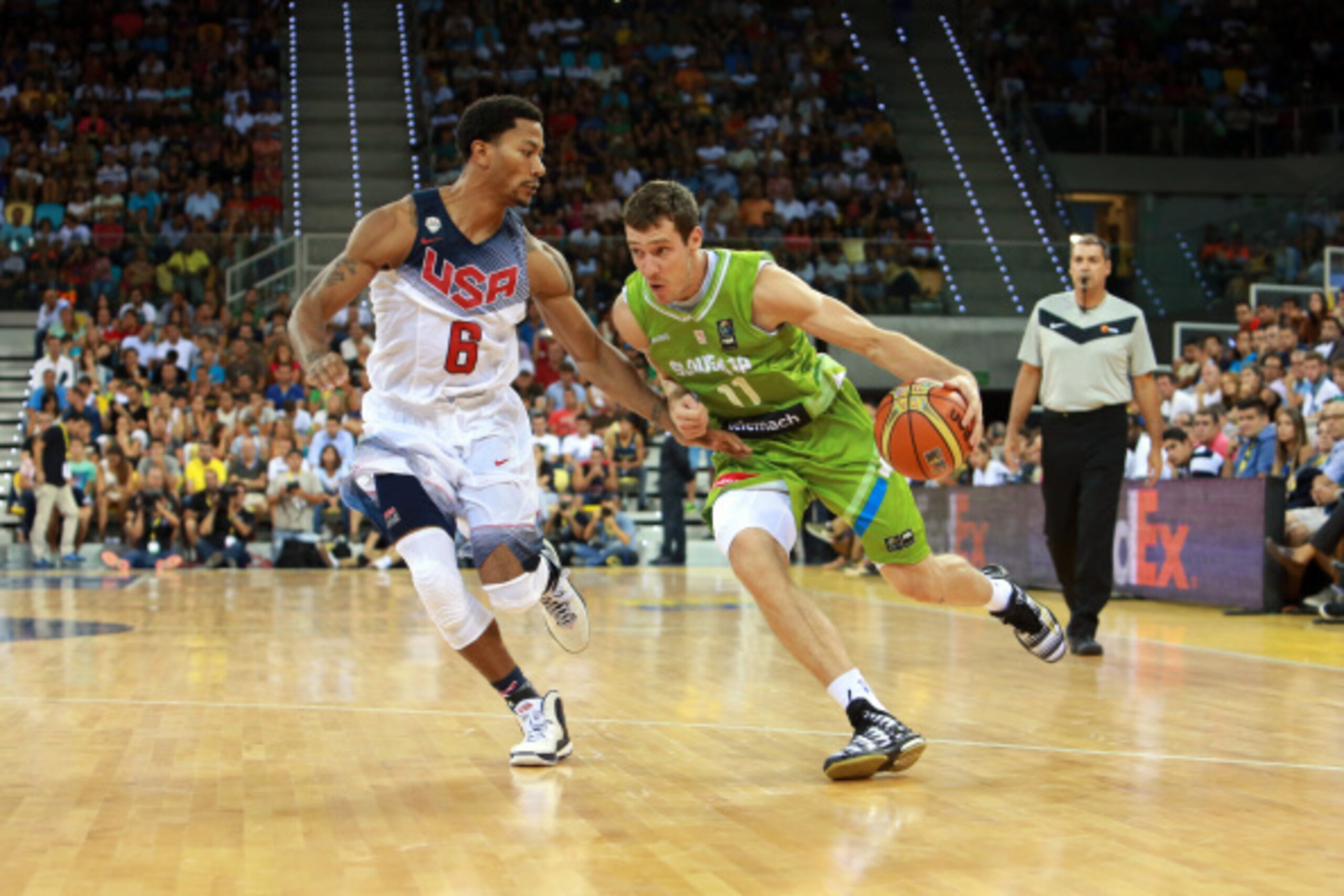 LAS PALMAS, GRAN CANARIA, SPAIN - AUGUST 26: Goran Dragic #11 of the Slovenia National Team drives against Derrick Rose #6 of the USA Men's National Team on August 26, 2014 at Gran Canaria Arena in Las Palmas, Gran Canaria, Spain. NOTE TO USER: User expre