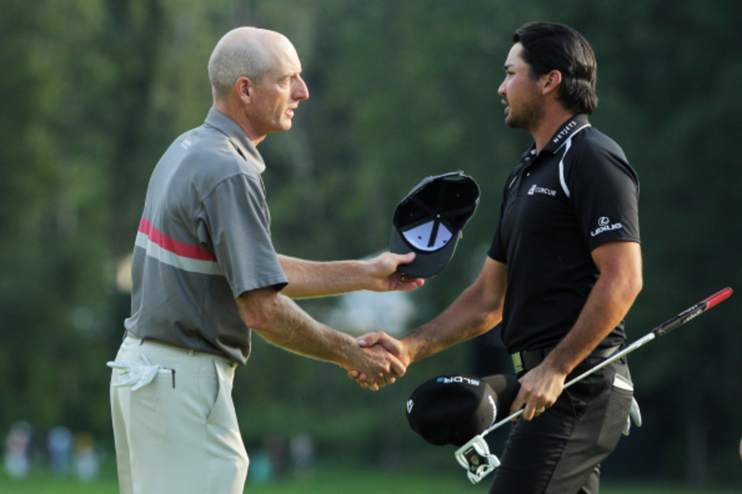PARAMUS, NJ - AUGUST 24:  Jim Furyk and Jason Day of Australia shake hands after finish on the 18th green during the final round of The Barclays at The Ridgewood Country Club on August 24, 2014 in Paramus, New Jersey.  (Photo by Hunter Martin/Getty Images