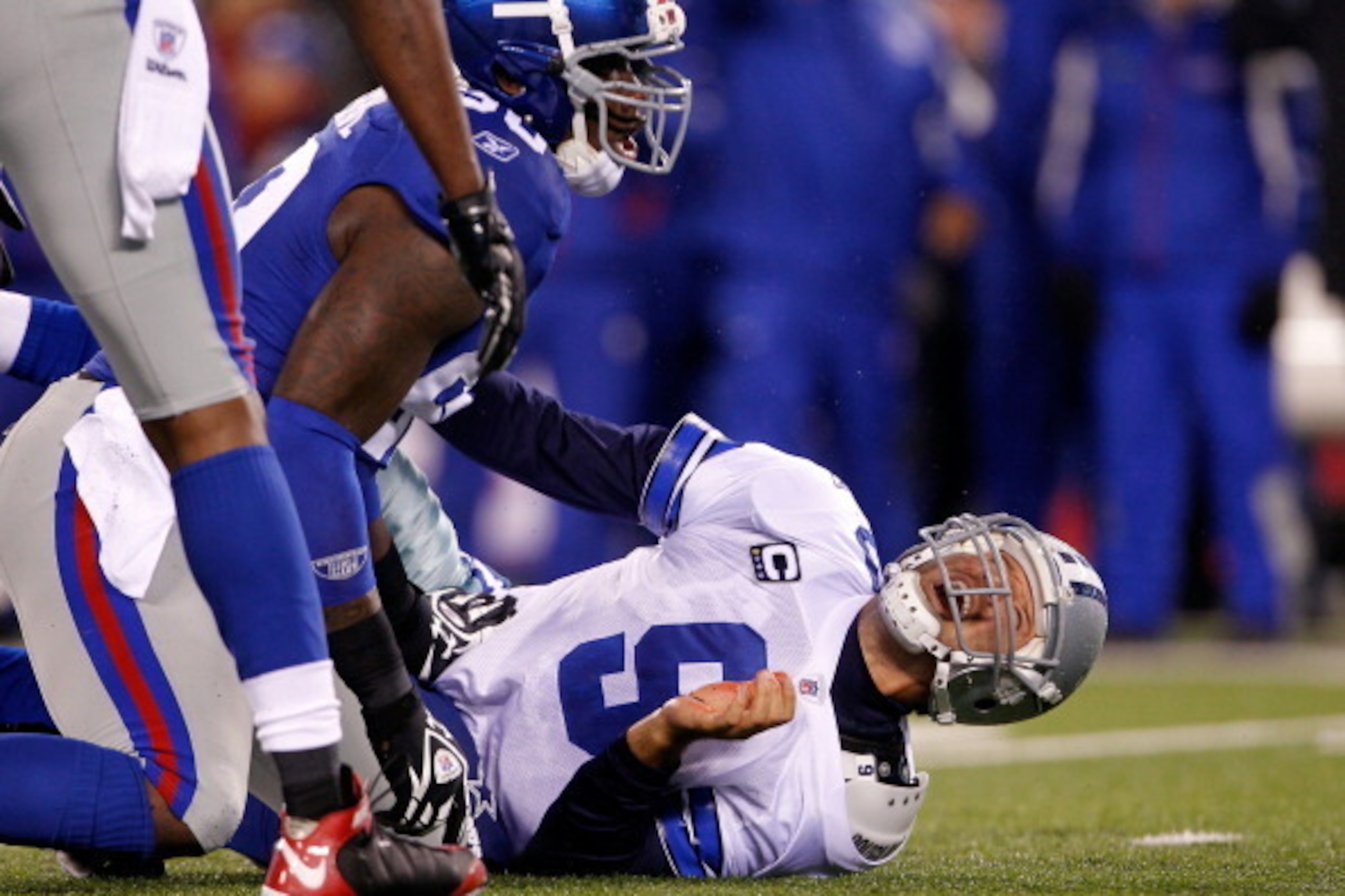 EAST RUTHERFORD, NJ - JANUARY 01:  Jason Pierre-Paul #90 of the New York Giants sacks Tony Romo #9 of the Dallas Cowboys in the first quarter at MetLife Stadium on January 1, 2012 in East Rutherford, New Jersey.  (Photo by Rich Schultz/Getty Images)