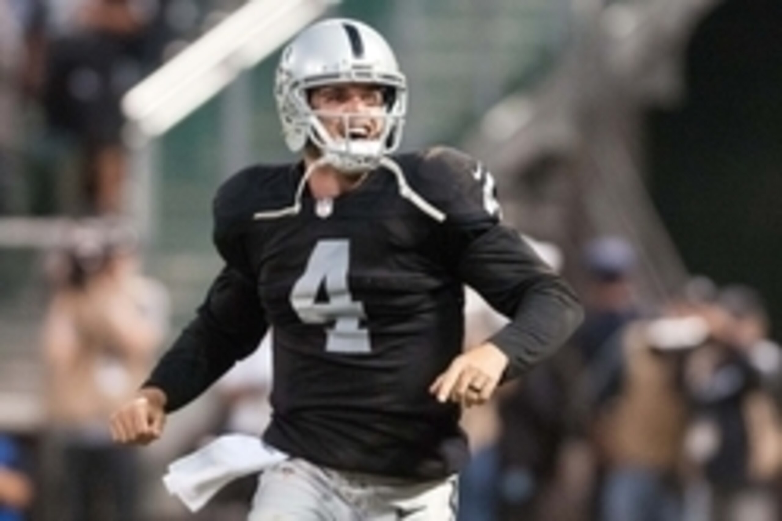 Aug 28, 2014; Oakland, CA, USA; Oakland Raiders quarterback Derek Carr (4) celebrates after throwing a touchdown pass against the Seattle Seahawks during the second quarter at O.co Coliseum. Mandatory Credit: Ed Szczepanski-USA TODAY Sports Aug 28, 2014; Oakland, CA, USA; Oakland Raiders quarterback Derek Carr (4) celebrates after throwing a touchdown pass against the Seattle Seahawks during the second quarter at O.co Coliseum. Mandatory Credit: Ed Szczepanski-USA TODAY Sports