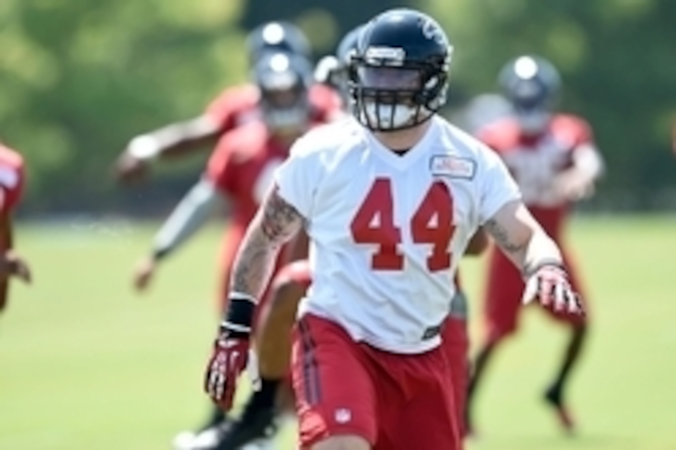 Jul 26, 2014; Atlanta, GA, USA; Atlanta Falcons linebacker Pat Angerer (44) warms up  during training camp at Falcons Training Complex. Mandatory Credit: Dale Zanine-USA TODAY Sports