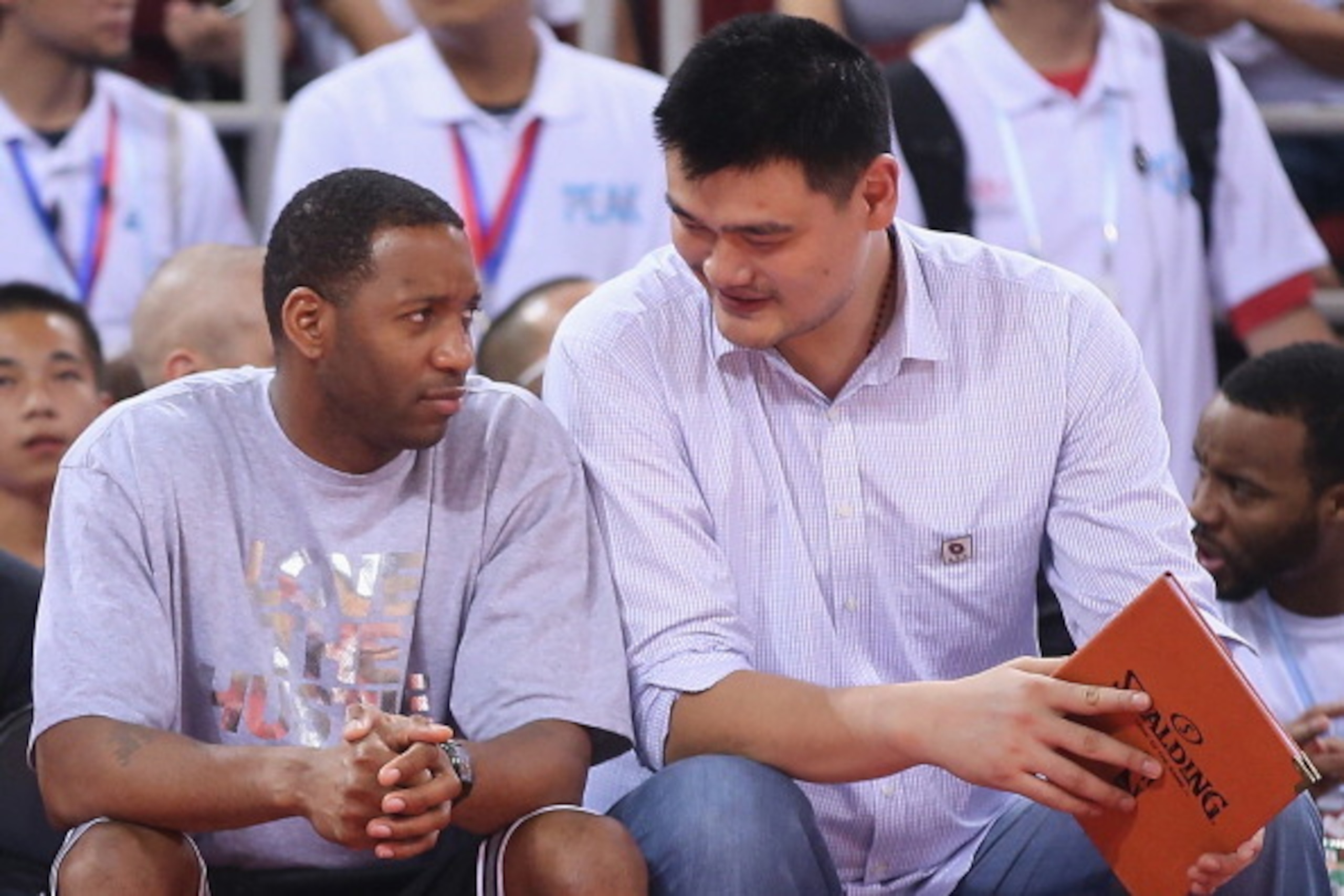 BEIJING, CHINA - JULY 01: Yao Ming (R) and NBA star Tracy McGrady watch the Yao Foundation Charity Game, sponsored by the charity foundation initiated by former Chinese basketball star Yao Ming, during the 2013 Yao Foundation Charity Game between China t BEIJING, CHINA - JULY 01: Yao Ming (R) and NBA star Tracy McGrady watch the Yao Foundation Charity Game, sponsored by the charity foundation initiated by former Chinese basketball star Yao Ming, during the 2013 Yao Foundation Charity Game between China t