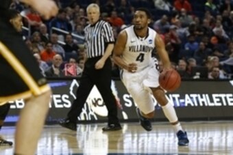 Mar 20, 2014; Buffalo, NY, USA;  Villanova Wildcats guard Darrun Hilliard II (4) drives to the baker against Milwaukee Panthers in the second  half of a men's college basketball game during the second round of the 2014 NCAA Tournament at First Niagara Cen