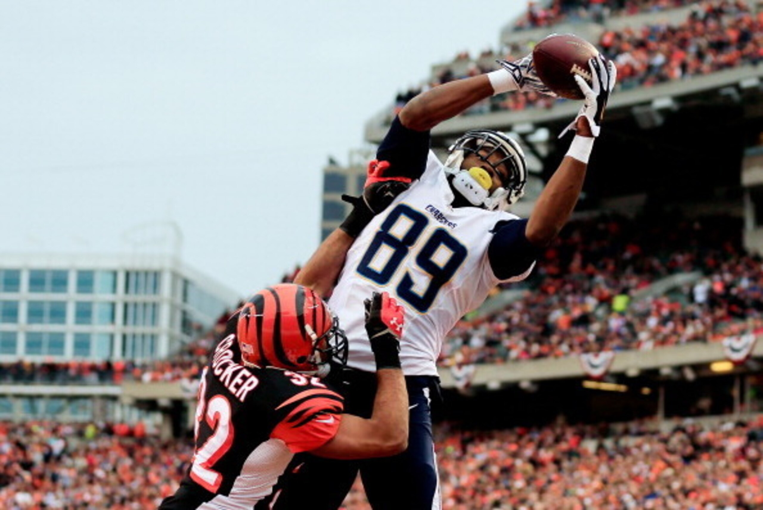 CINCINNATI, OH - JANUARY 05: Tight end Ladarius Green #89 of the San Diego Chargers catches a touchdown in the third quarter as defensive back Chris Crocker #32 of the Cincinnati Bengals defends during a Wild Card Playoff game at Paul Brown Stadium on Jan