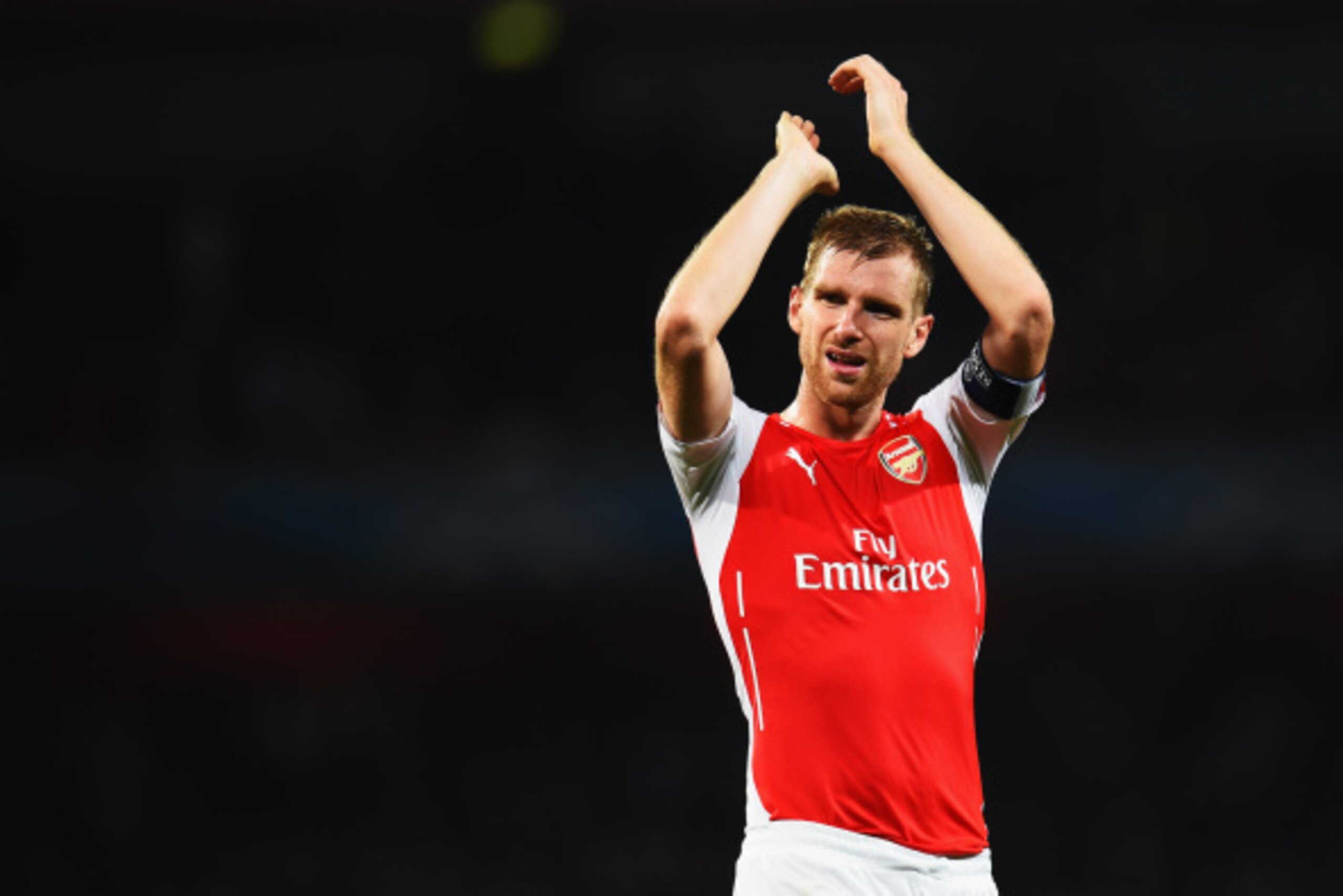 LONDON, ENGLAND - AUGUST 27:  Per Mertesacker of Arsenal celebrates at the end of the UEFA Champions League Qualifier 2nd leg match between Arsenal and Besiktas at the Emirates Stadium on August 27, 2014 in London, United Kingdom.  (Photo by Shaun Botteri